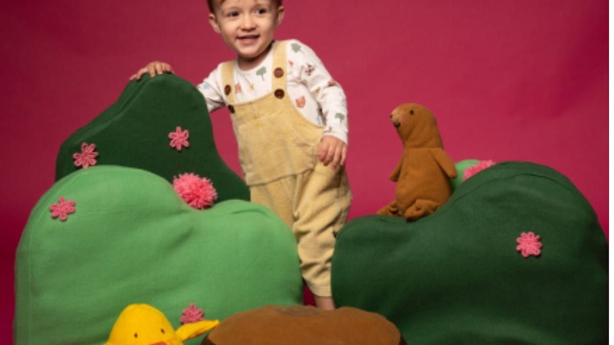 little child with soft toys around hime little child with soft toys around hime