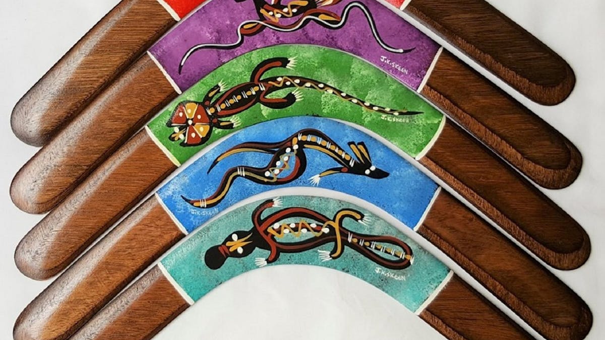 Colorful hand painted contemporary animal designs on Aboriginal wooden returning boomerangs; Colorful hand painted contemporary animal designs on Aboriginal wooden returning boomerangs;