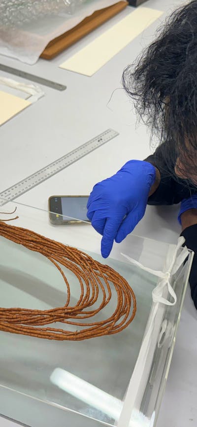 Conservation treatment by Maree Clark on one of her works