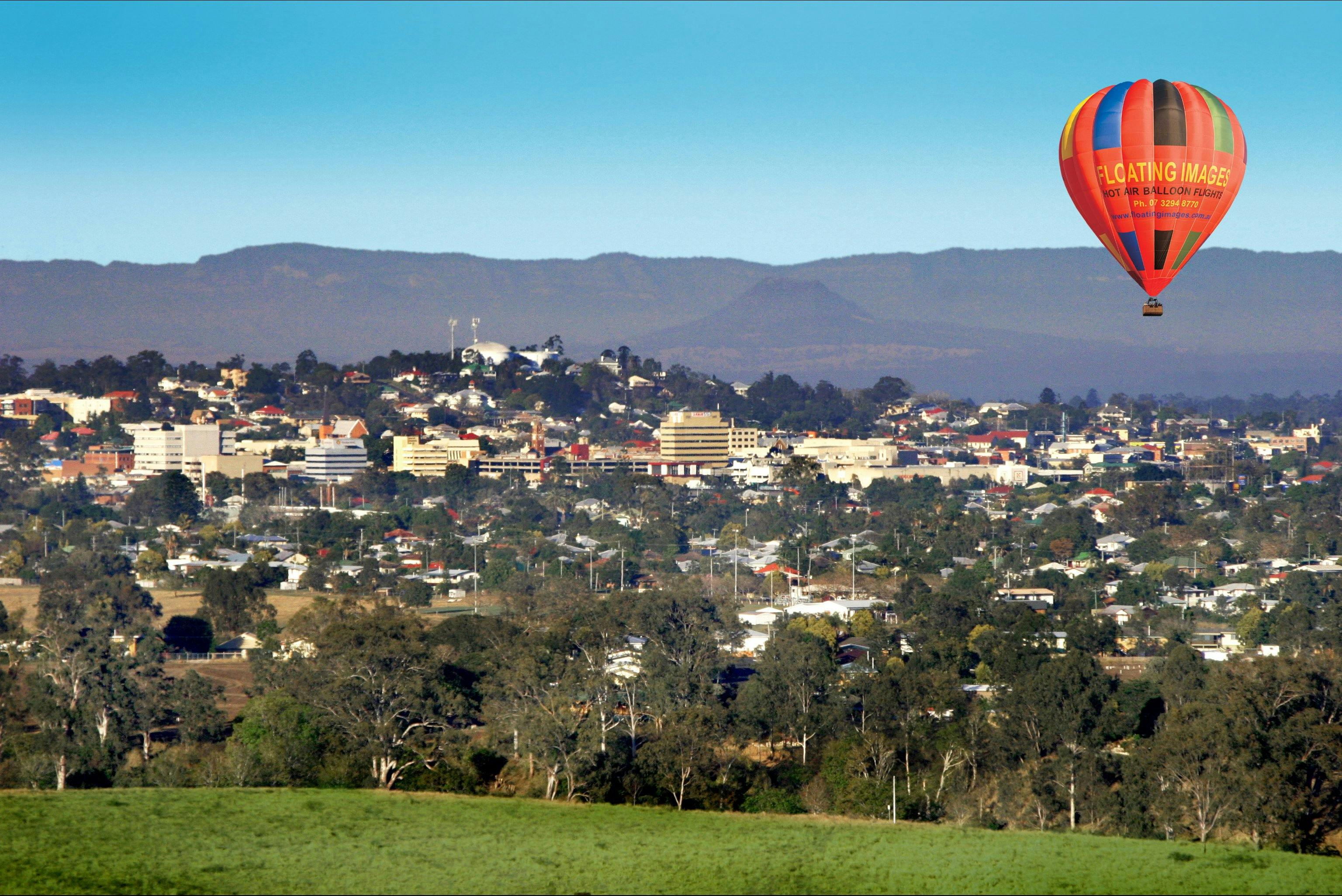 Hot air balloon flights over the heritage city of Ipswich with the Great Dividing Range behind