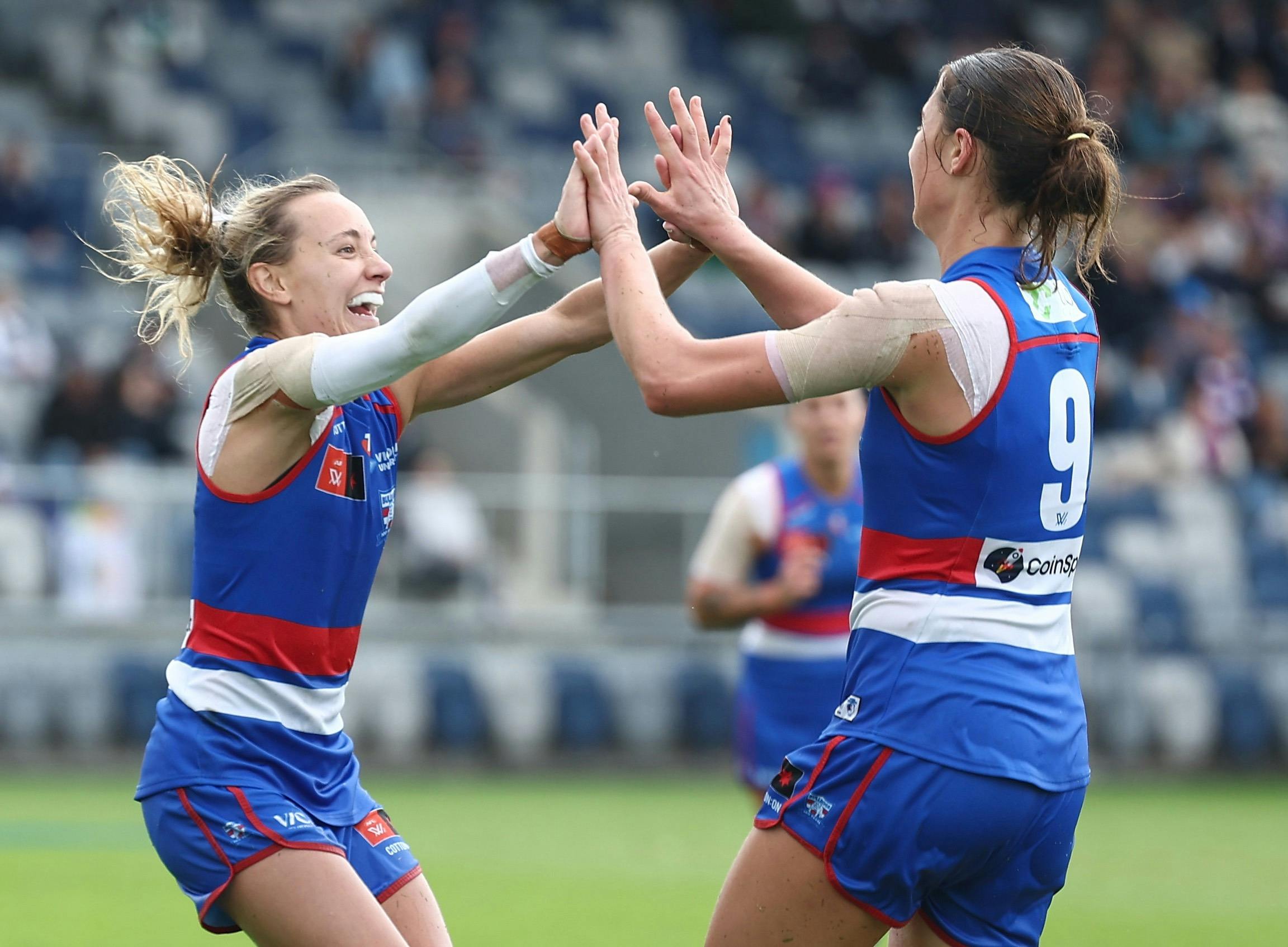 Western Bulldogs teammates celebrating.