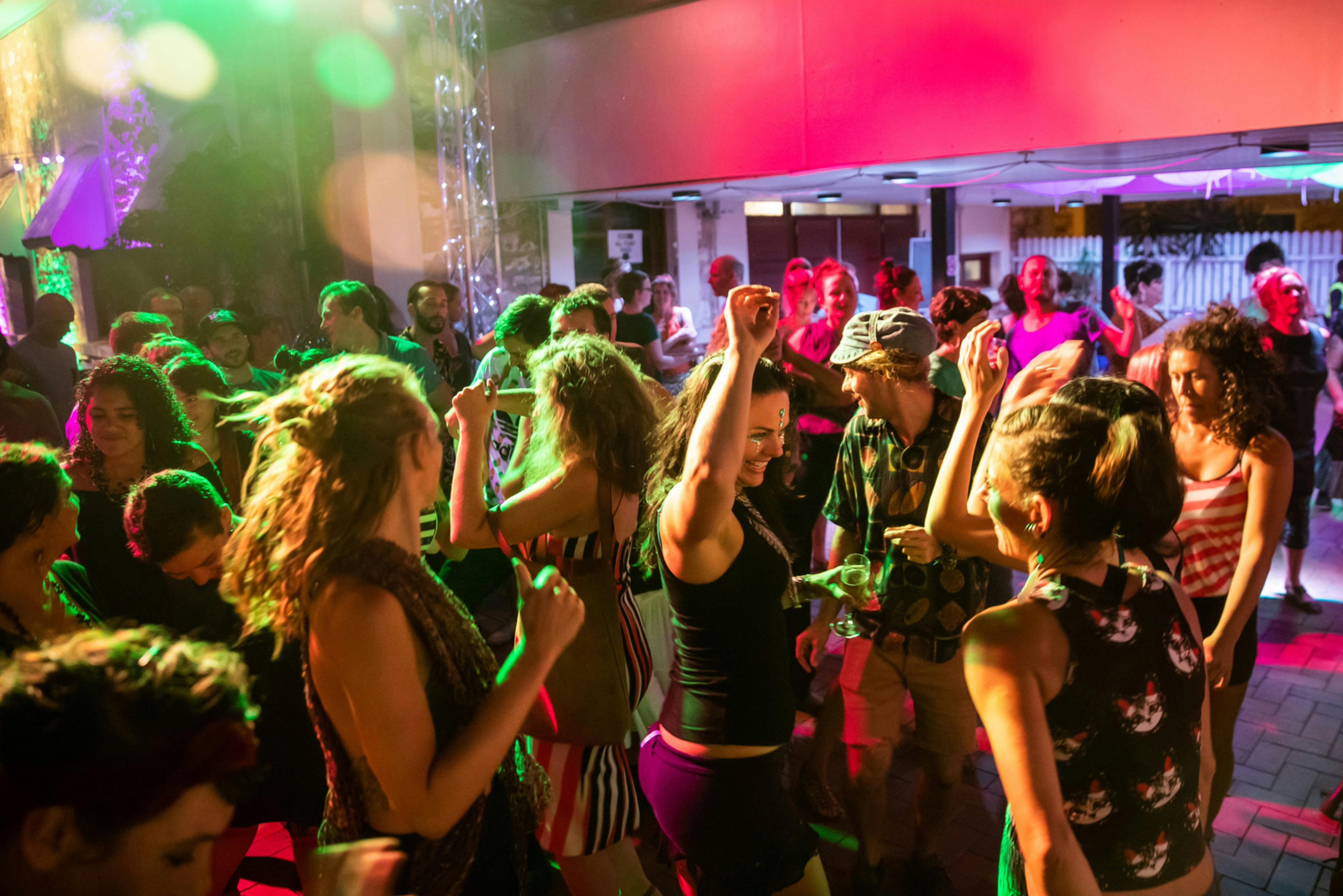 People dancing at the 2019 Darwin Fringe Opening Night Party in Brown's Mart Courtyard
