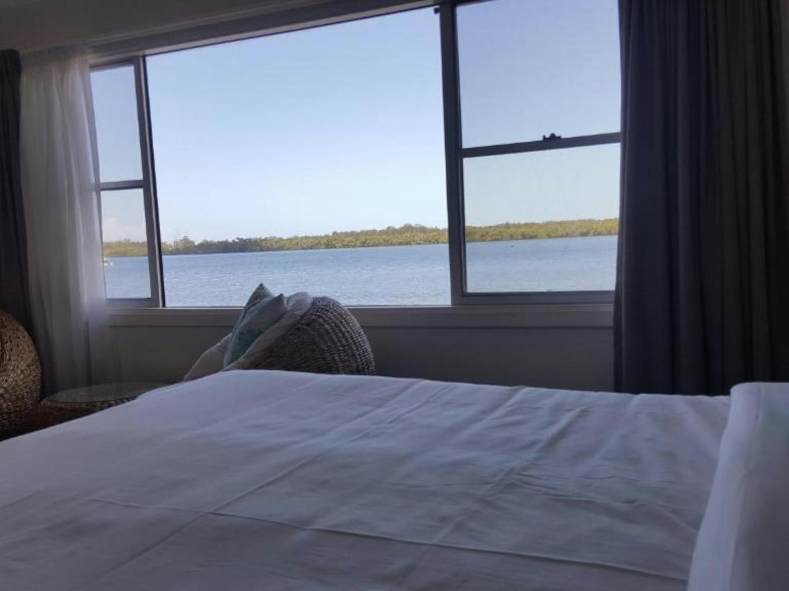 Bedroom with river views out of large window