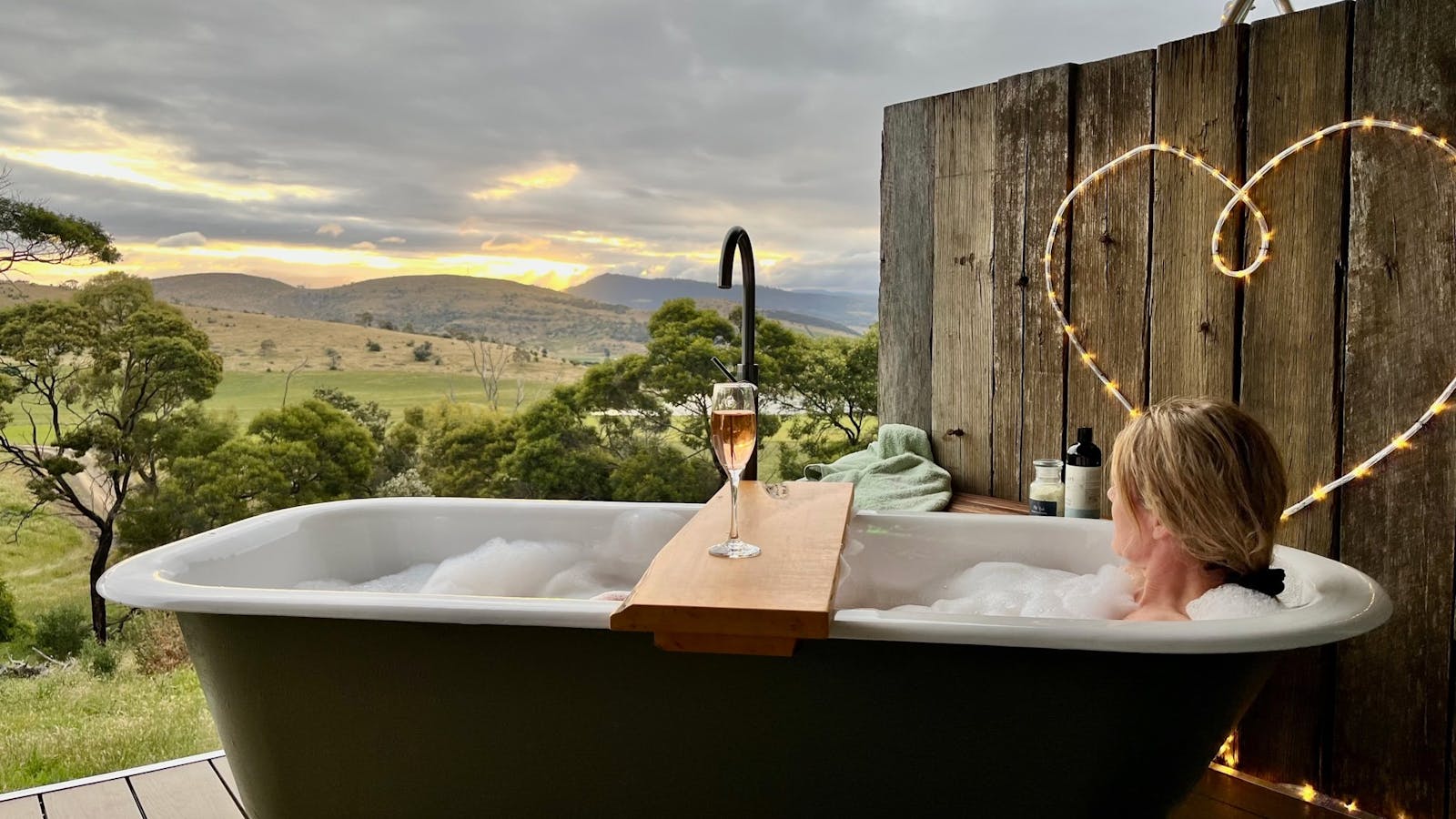 Outdoor bath on deck at glamping tent