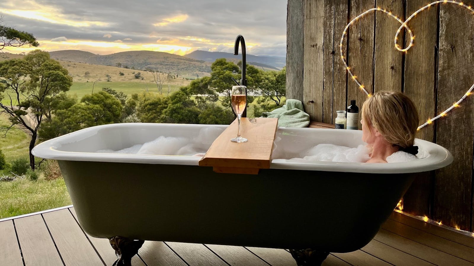 Outdoor bath on deck at glamping tent