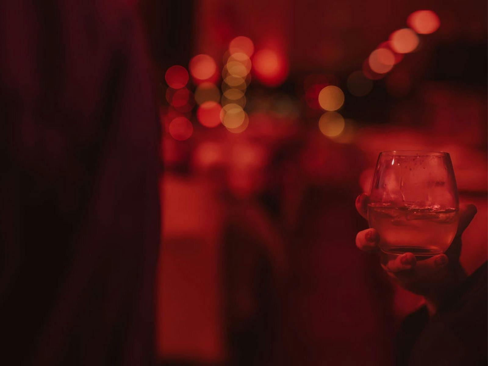 Drink in hand on Strahan Solstice Cruise with World Heritage Cruises.