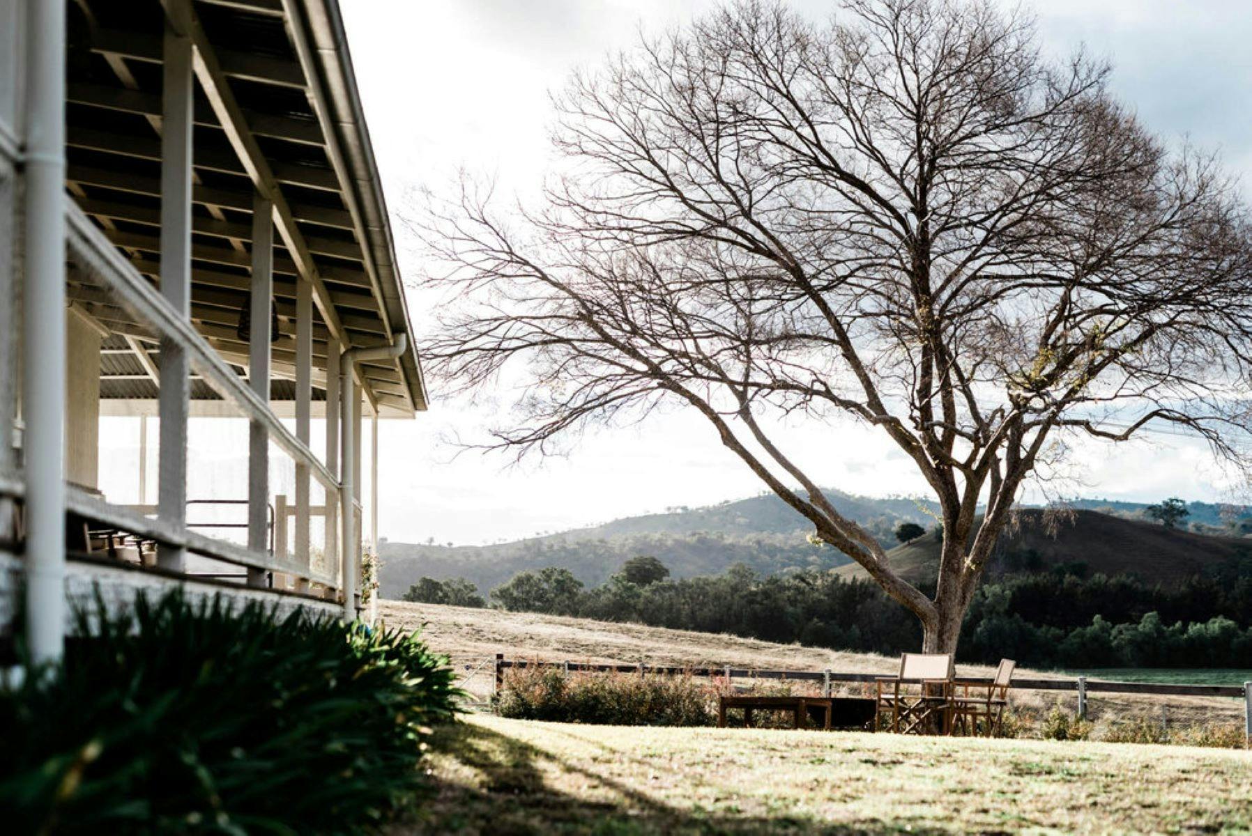 Verandah with tree on hill