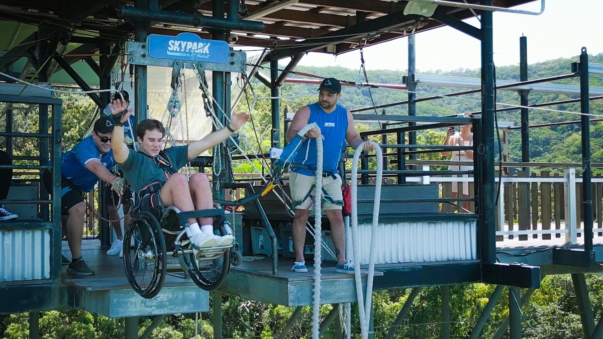 Man Bungy Jumping in his wheelchair