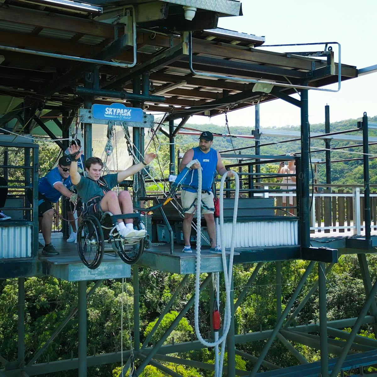 Man Bungy Jumping in his wheelchair