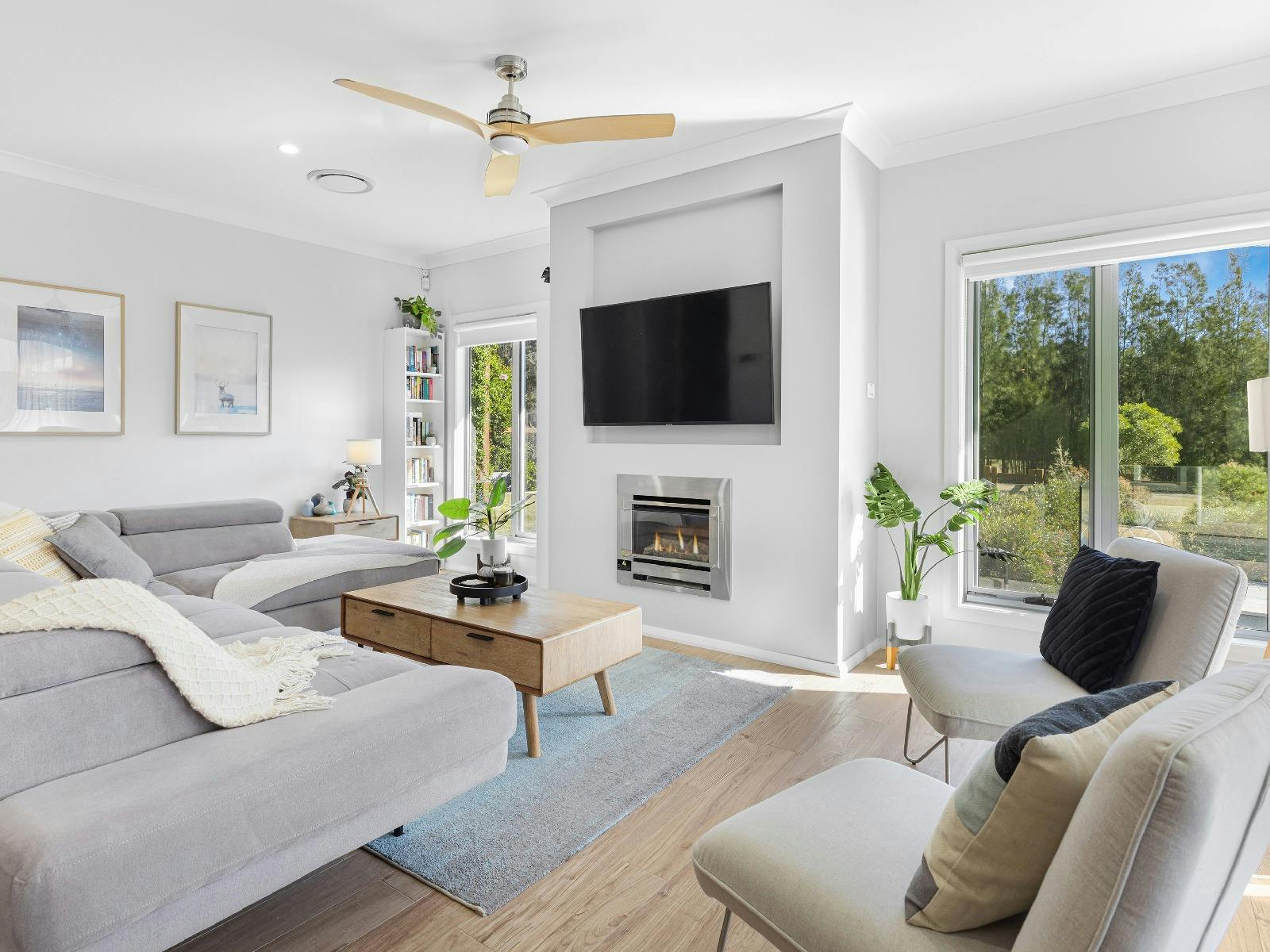 Kokoon lounge room with fireplace and TV