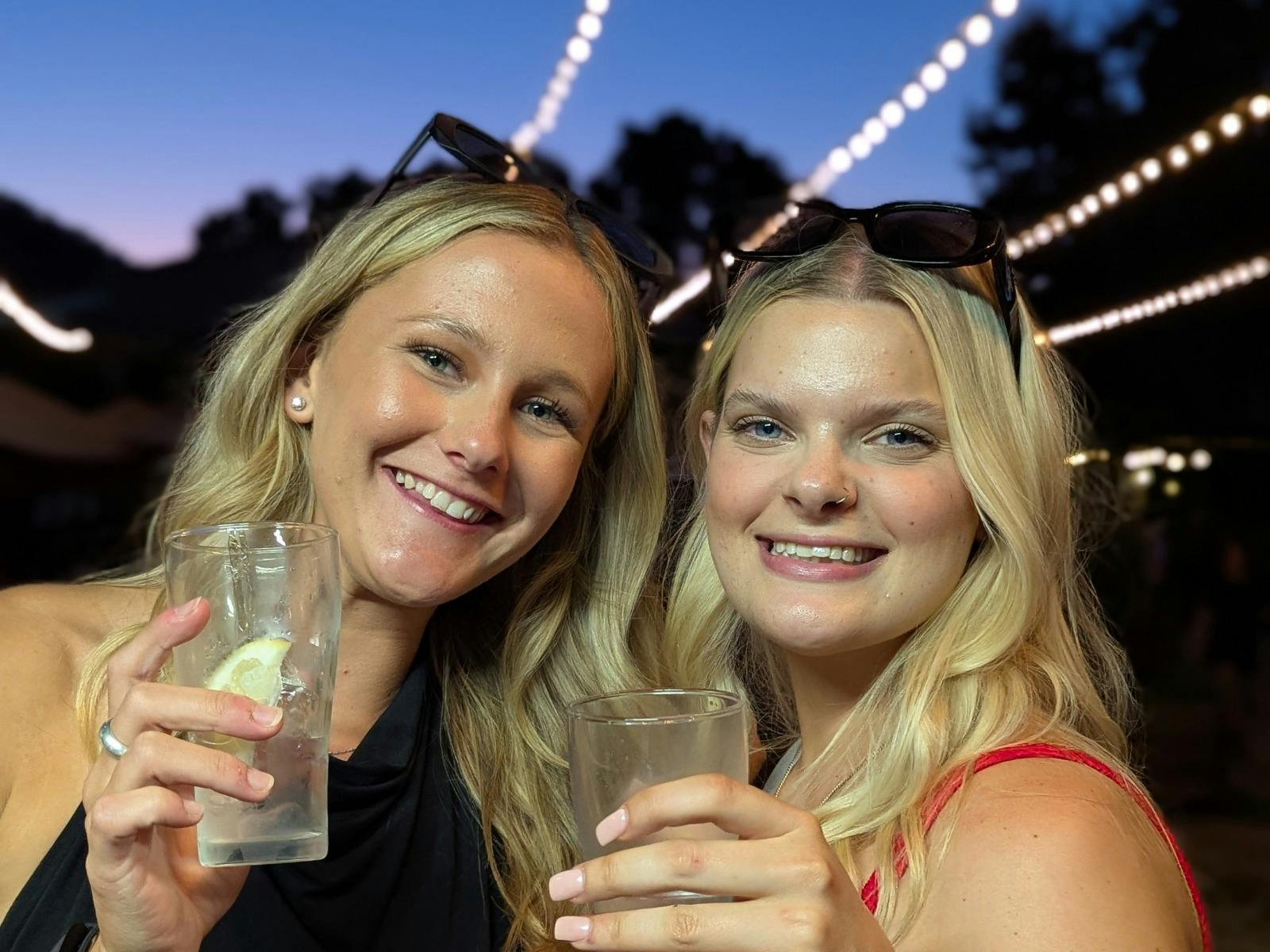 Friends enjoying a drink at twilight