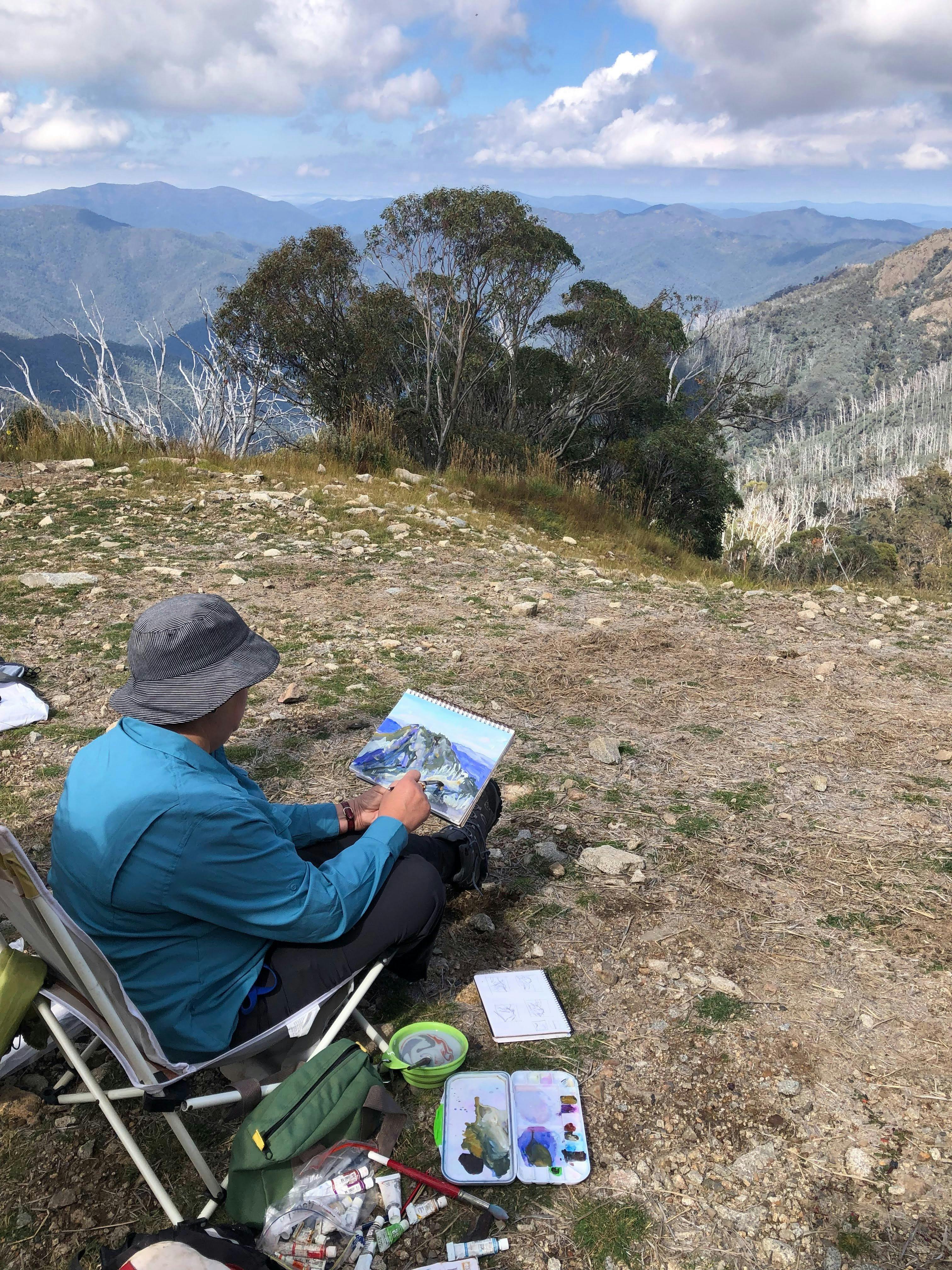 Artist paints the mountain view