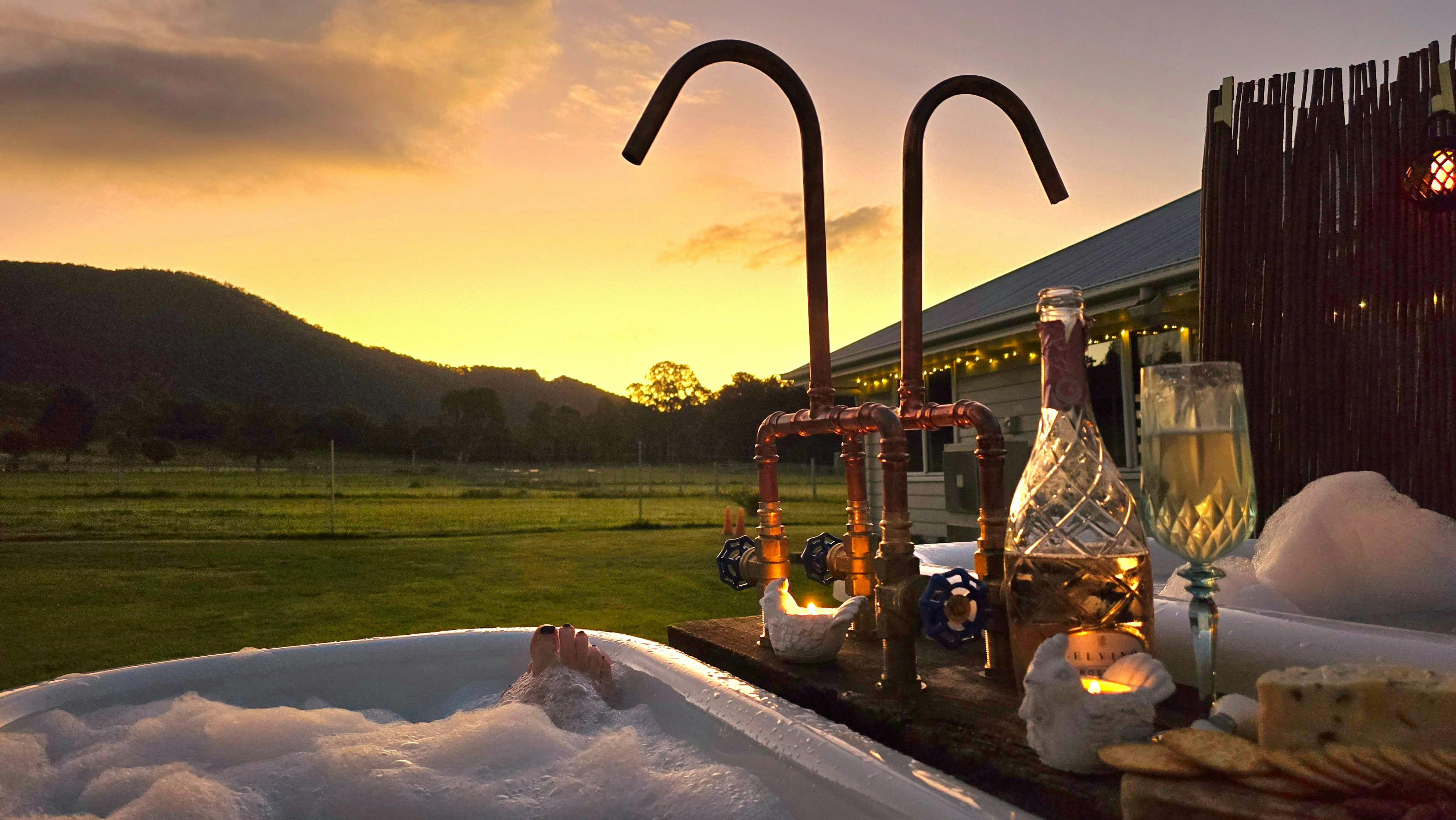Relax in piping hot water in the dual outdoor baths overlooking the mountains  at Fig Tree Farm B&B.