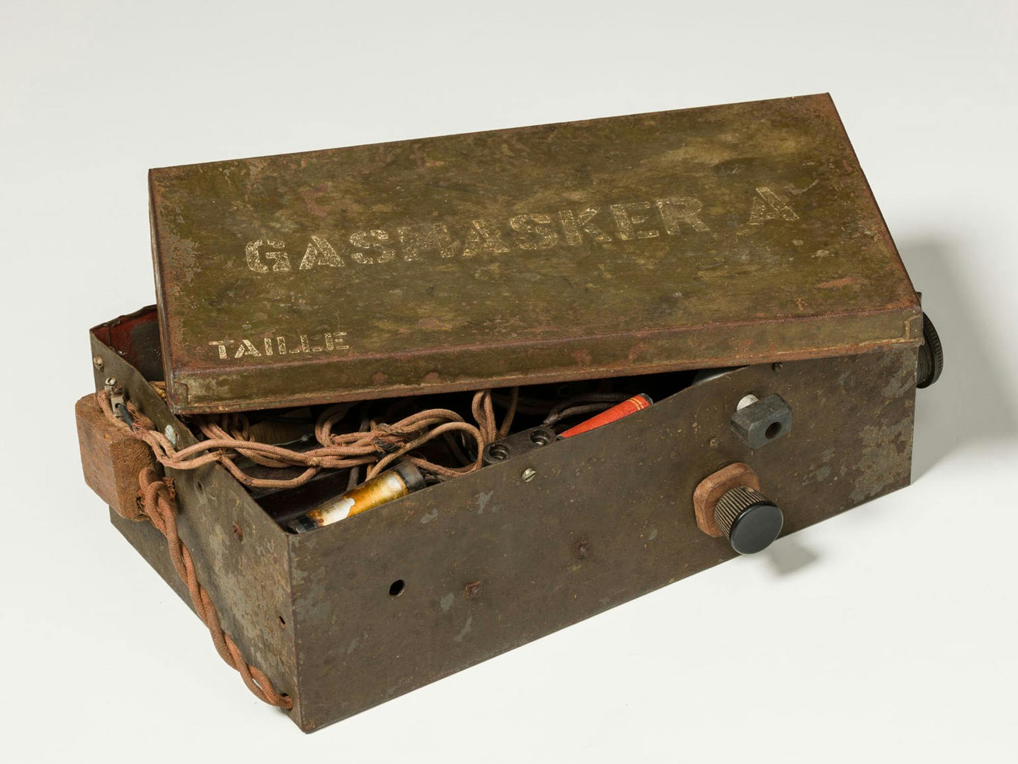 Metal military container with hidden electronics inside.