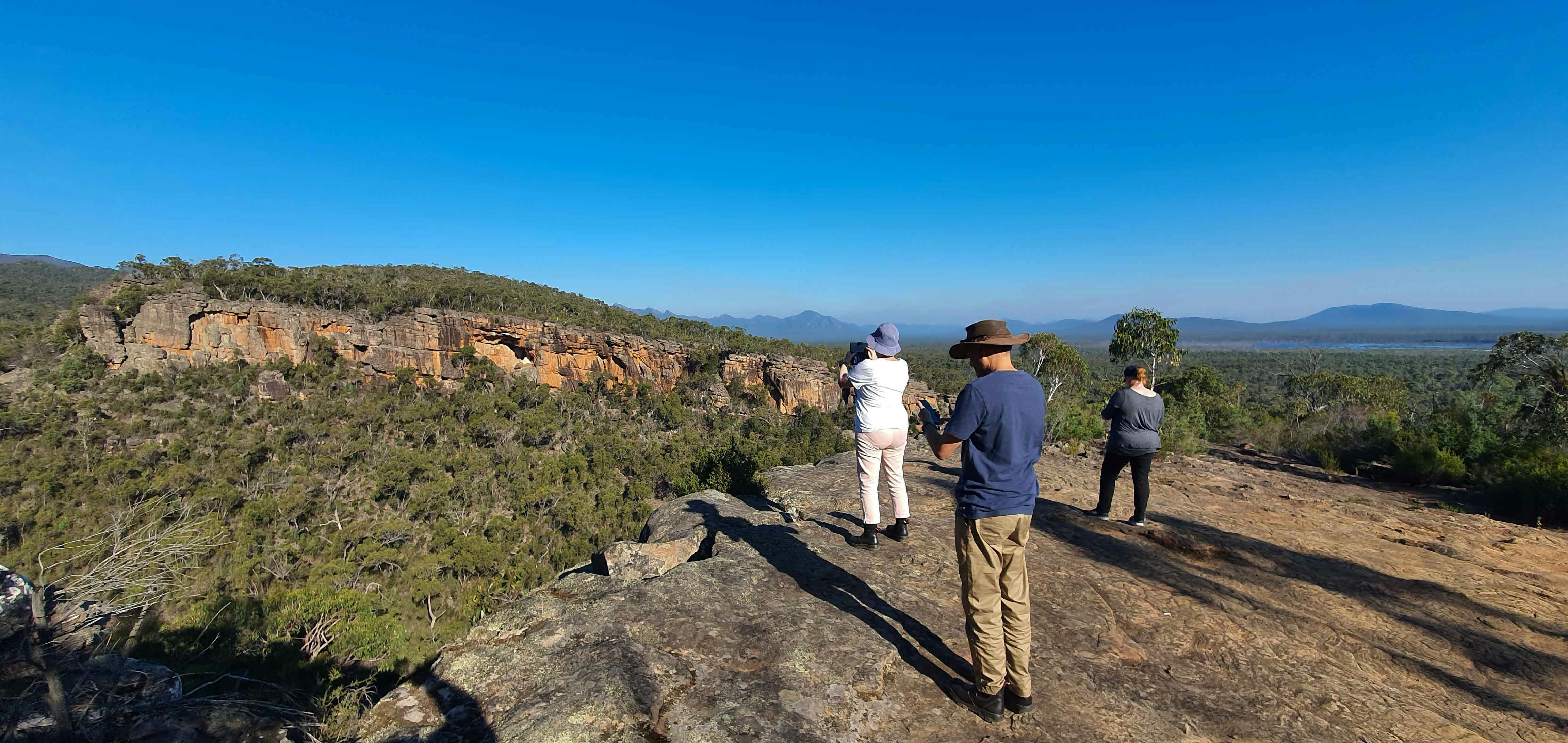 A group of people taking in the views of the mountains.