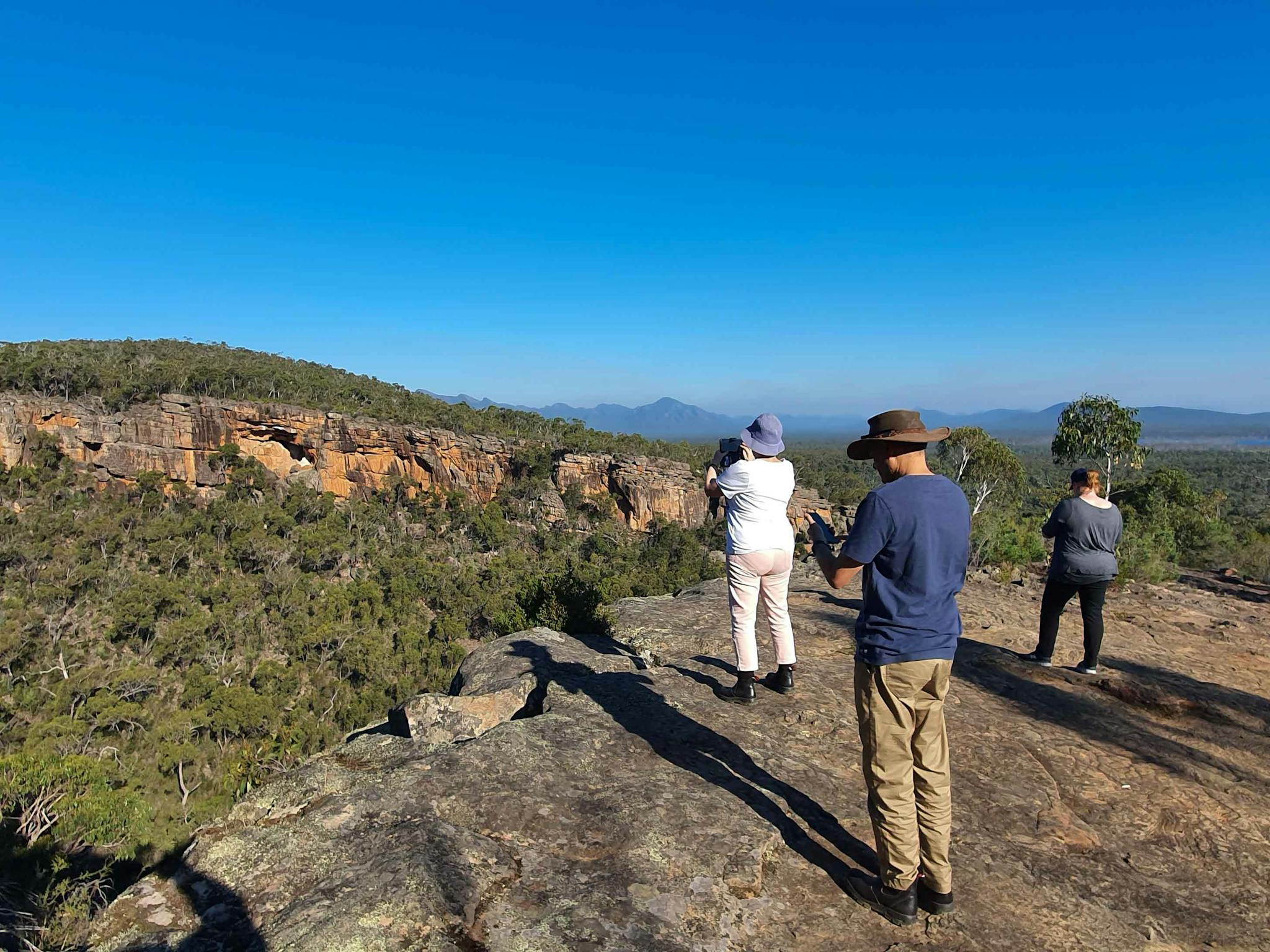 A group of people taking in the views of the mountains.