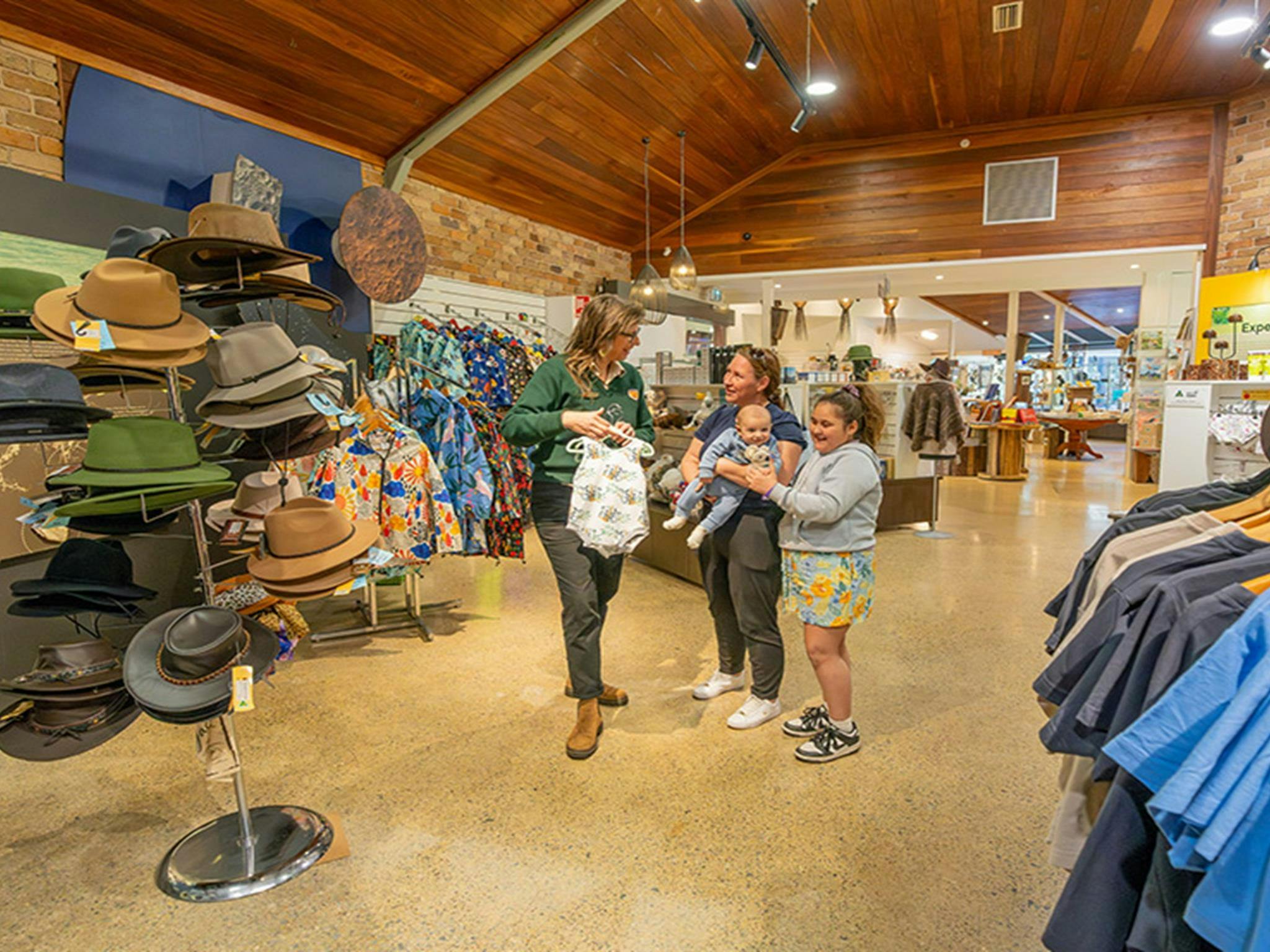 Staff helping visitors at Dorrigo Rainforest Centre. Photo: John Spencer/DCCEEW &copy; DCCEEW
