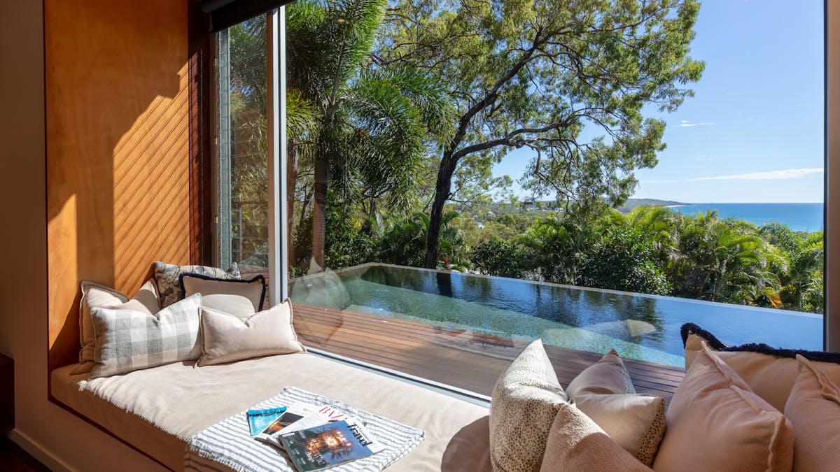Relax on the daybed looking over the infinity pool and spectacular view.
