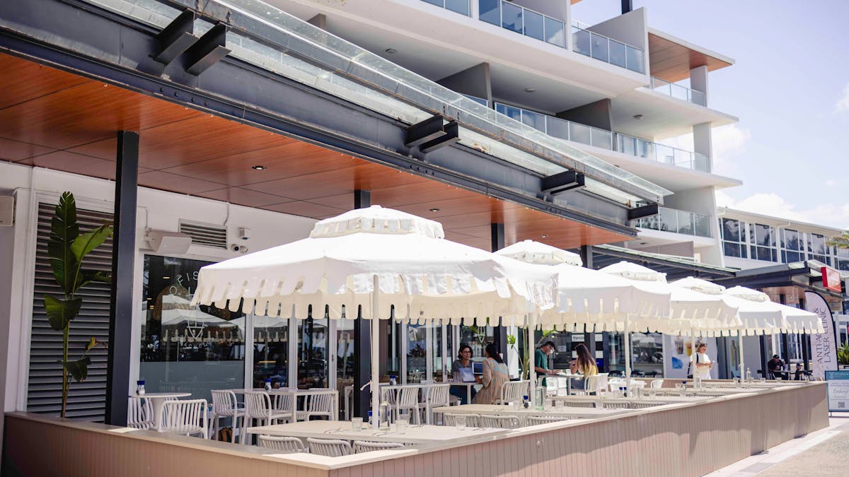 Beautiful outdoor dining under our picnic umbrellas with ocean and island views