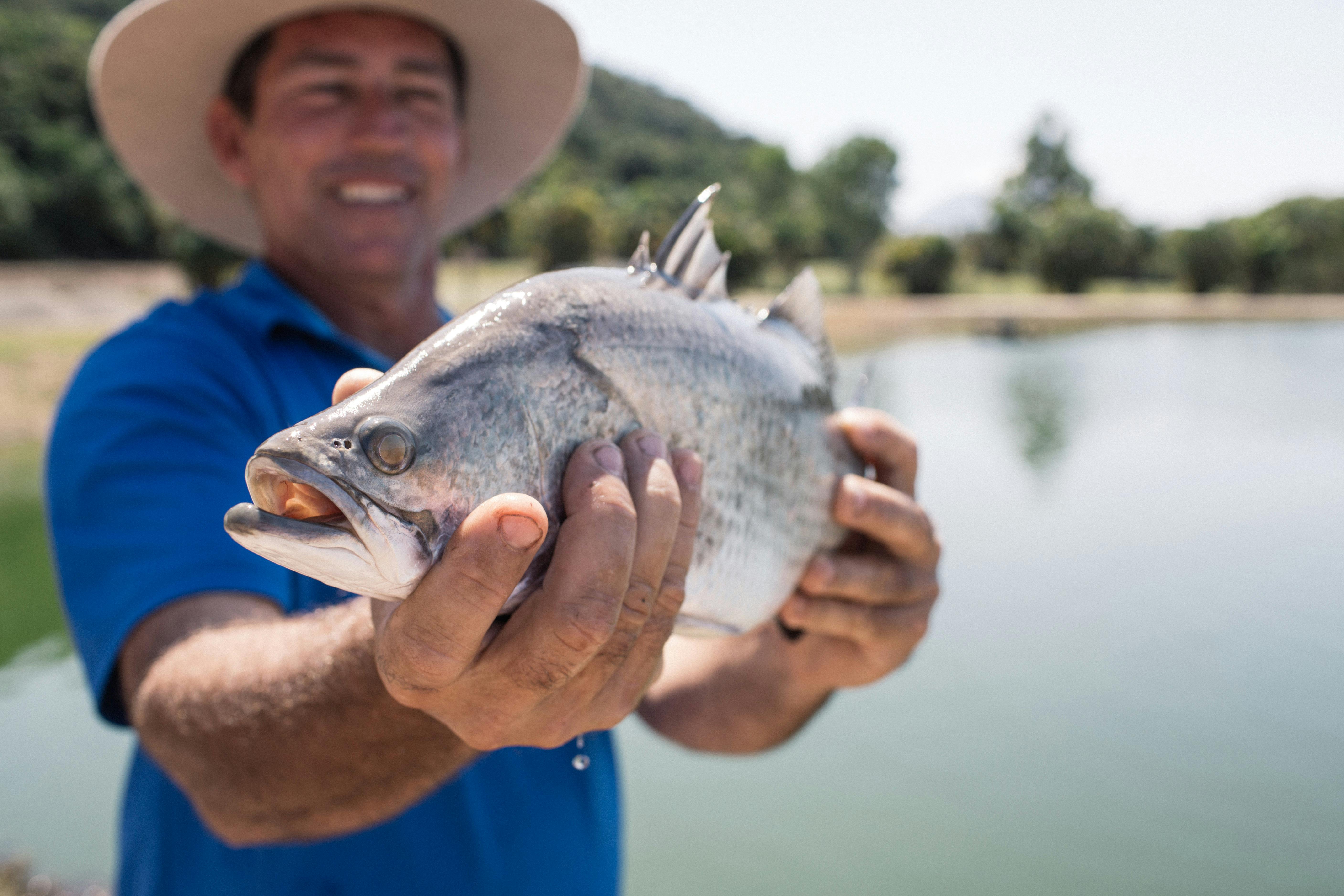 Farmer Holding Fish