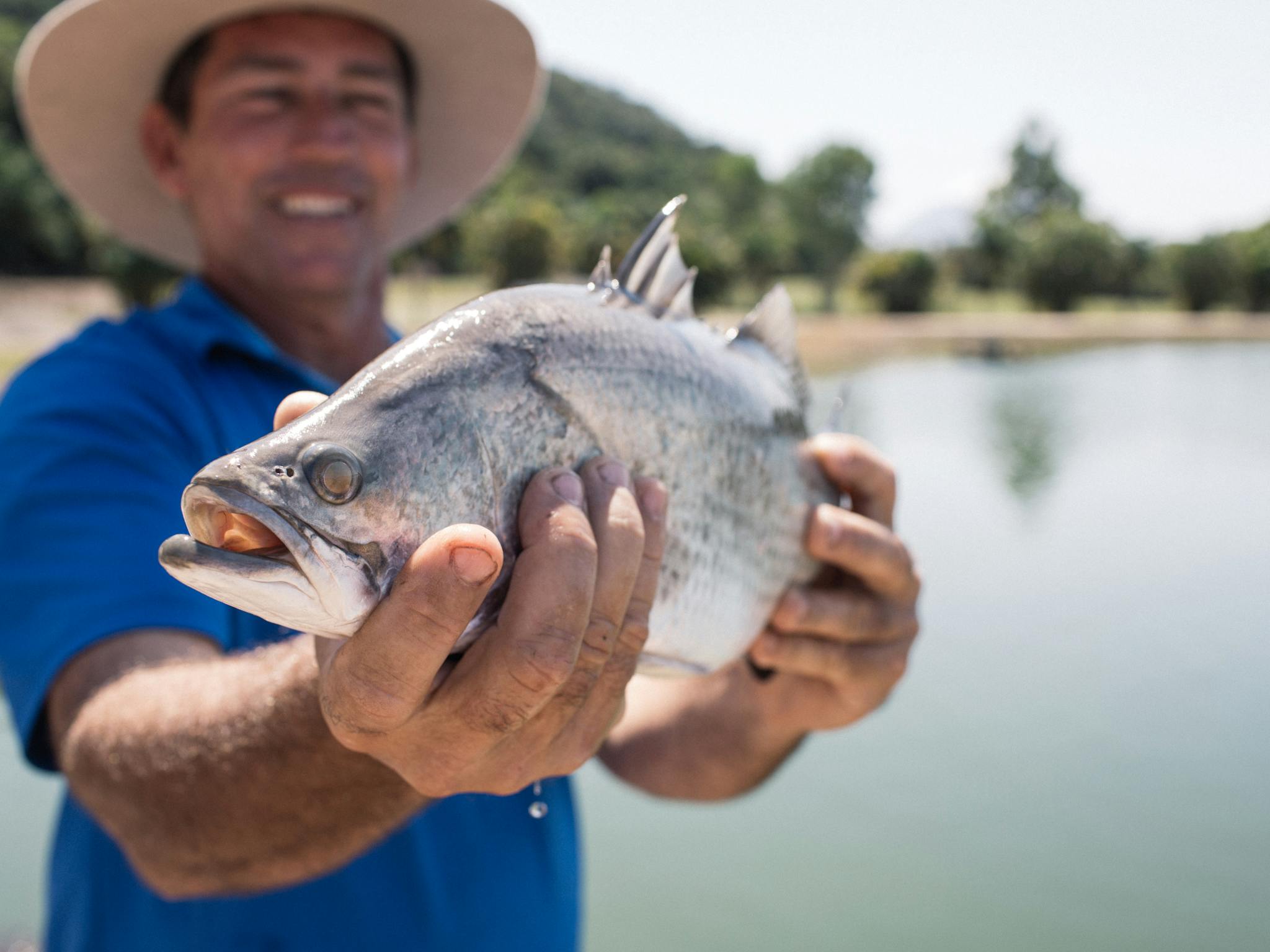 Farmer Holding Fish Farmer Holding Fish