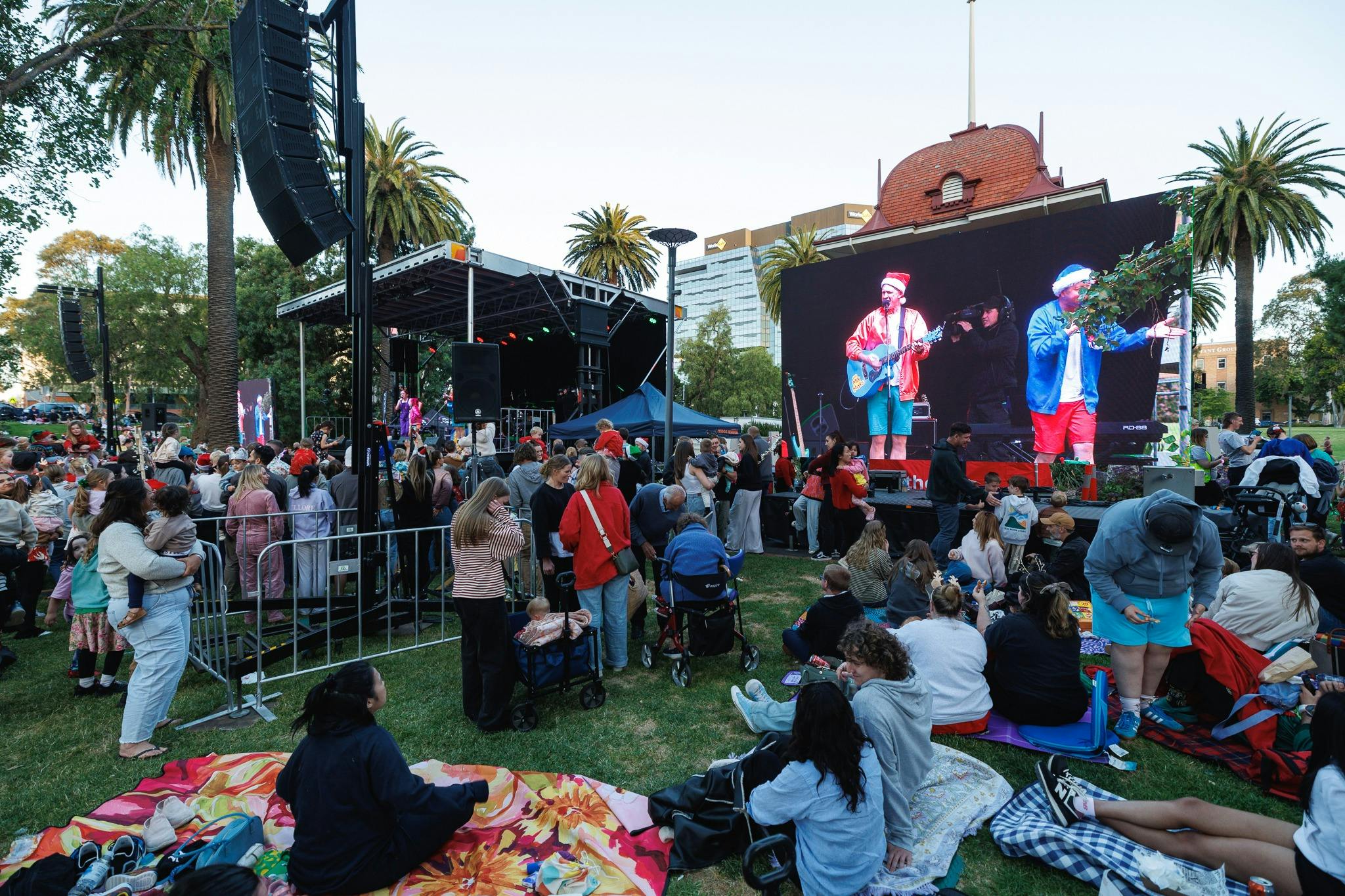 Children dancing and singing with the Mik Maks at the front of the stage