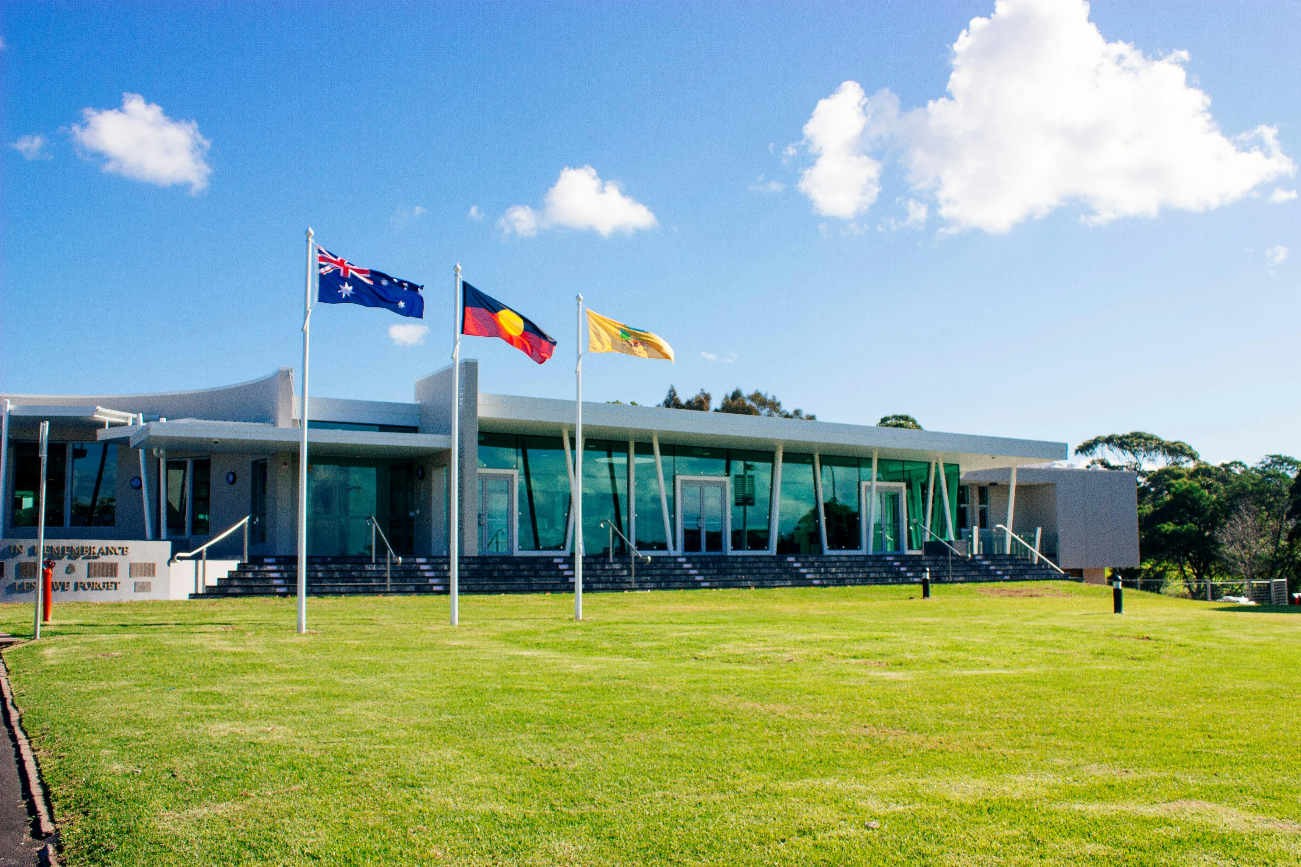Three flags flying out the front of the Ulladulla Civic Centre