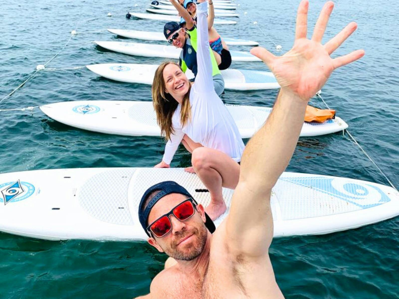 Fun with SUP Yoga group classes Manly Beach