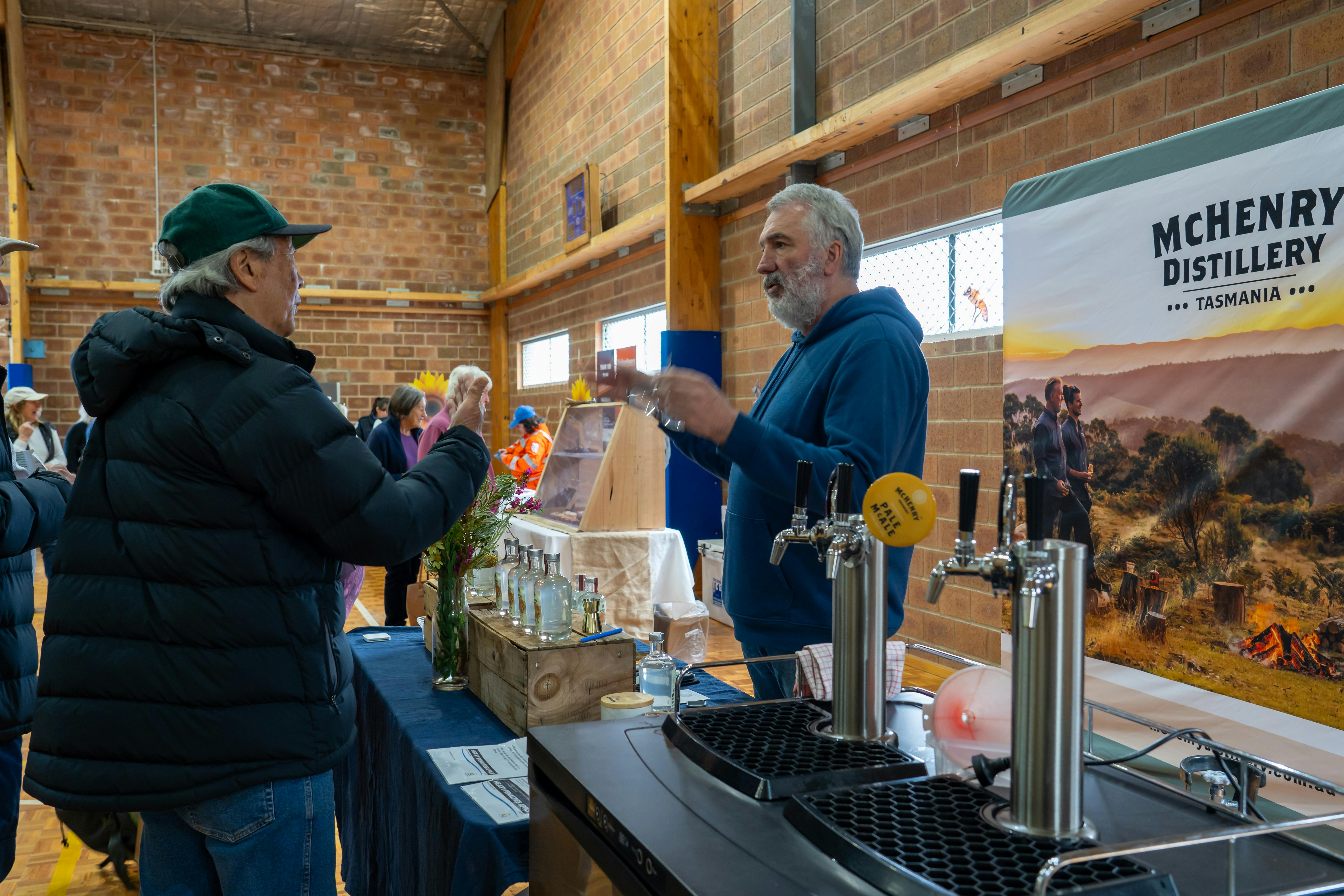 Bill McHenry taking a moment to share his amazing Honey Vodka with an attendee