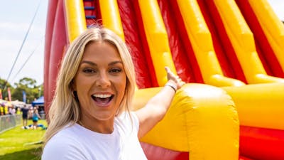 A Woman in front of the massive Kami Kazi Inflatable Slide