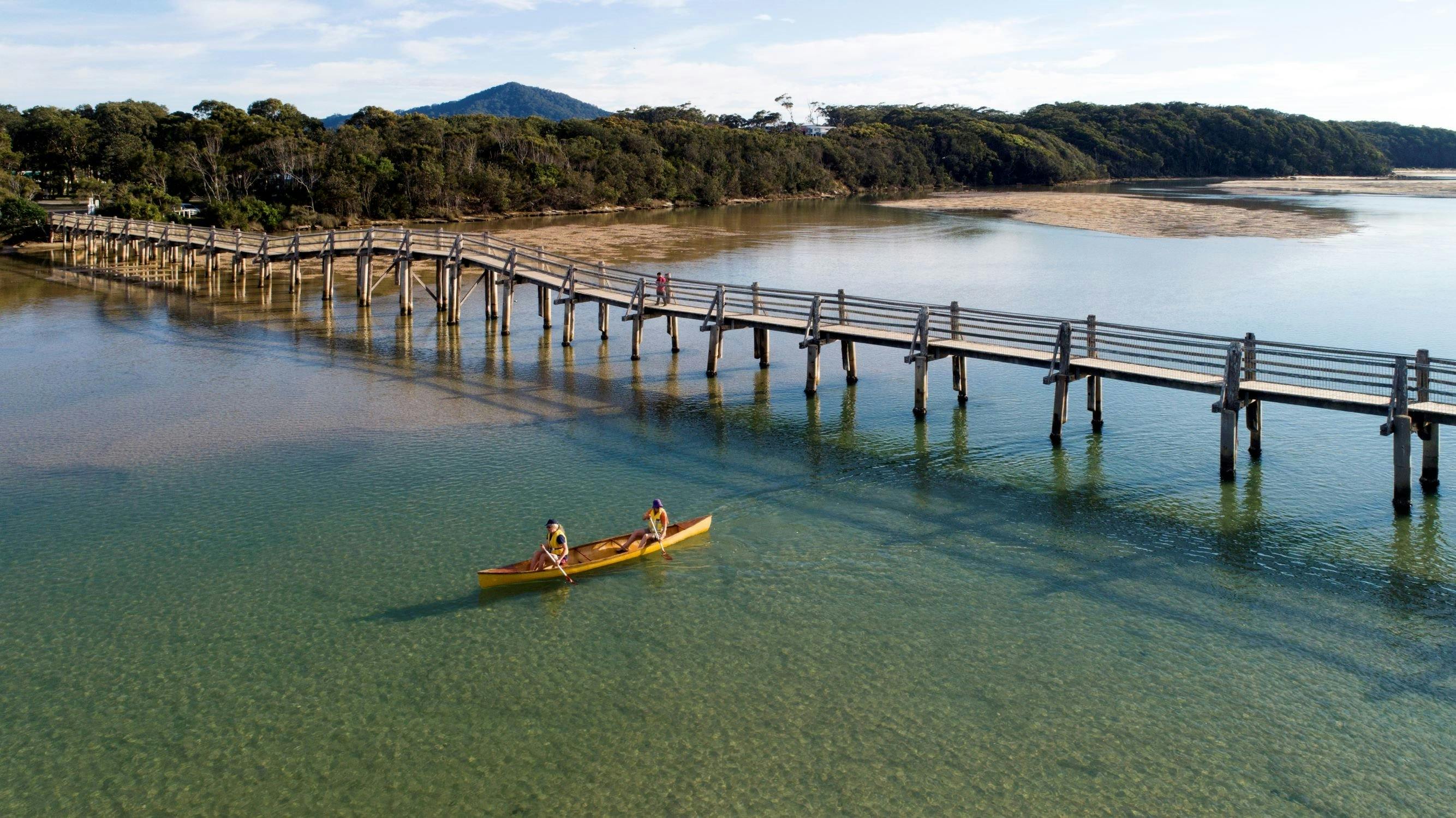 Paddling in Deep Creek under the footbridge at Valla Beach