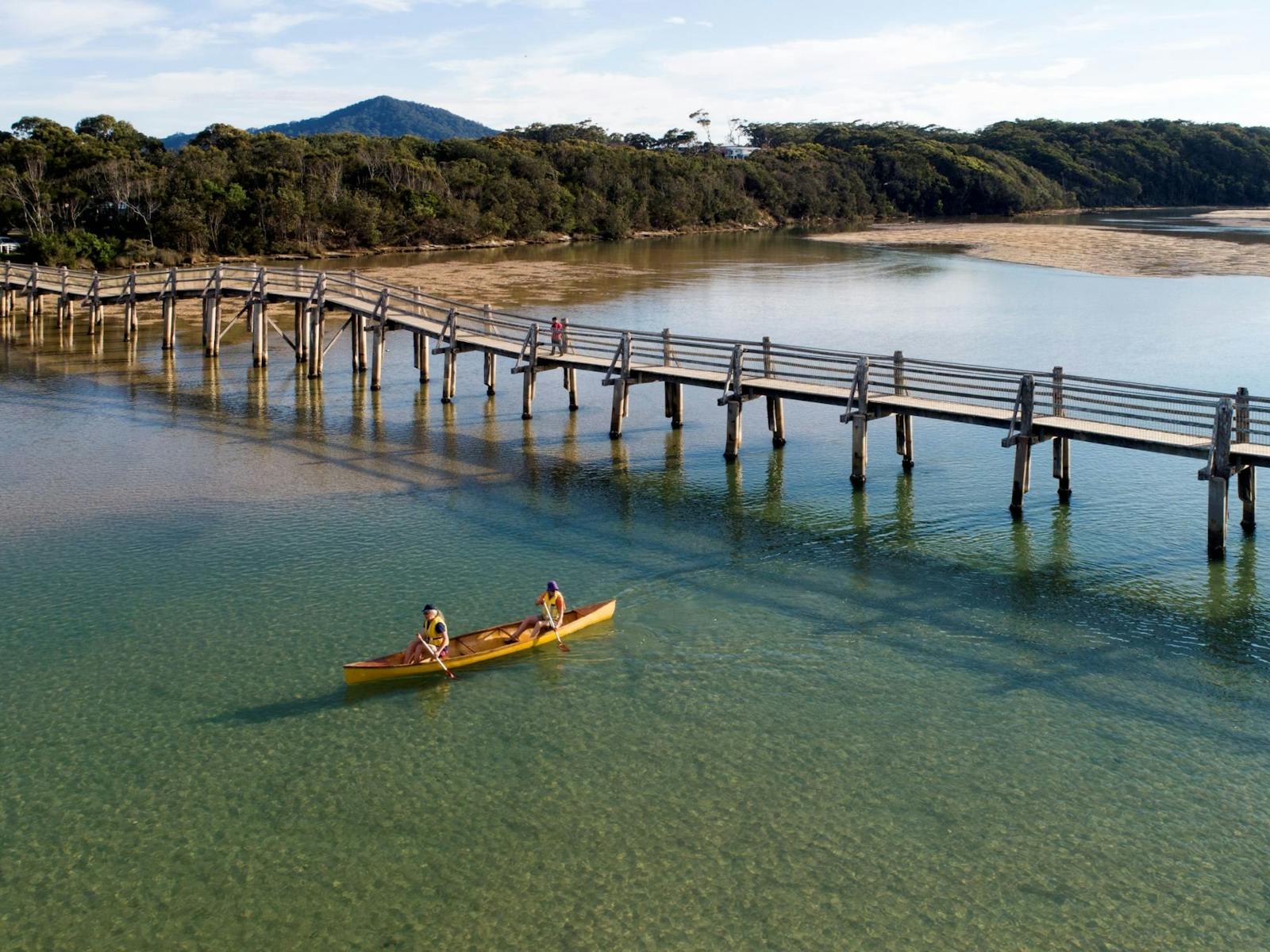Paddling in Deep Creek under the footbridge at Valla Beach