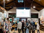 A group of people viewing the artworks on display