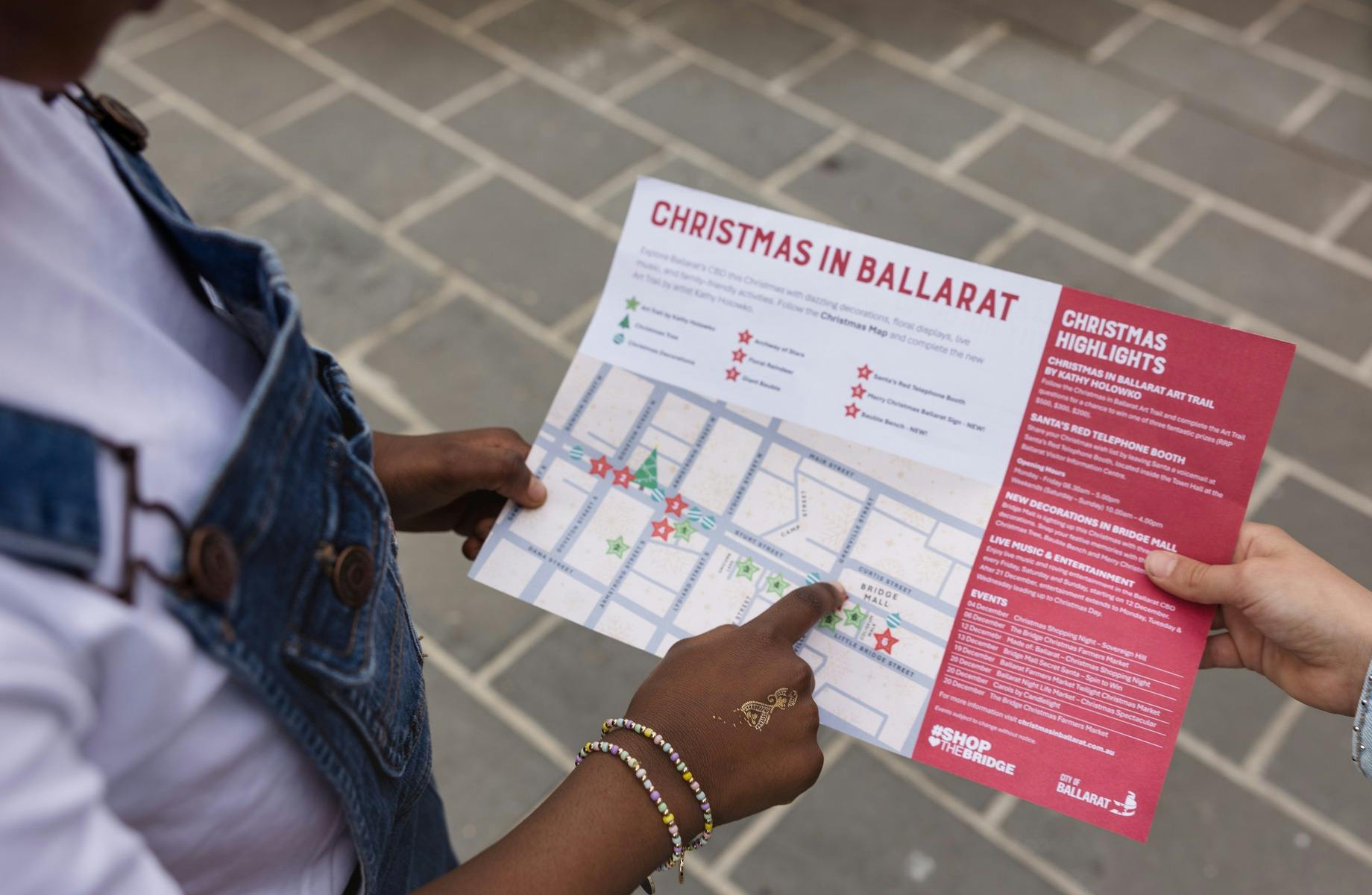 Child pointing at map