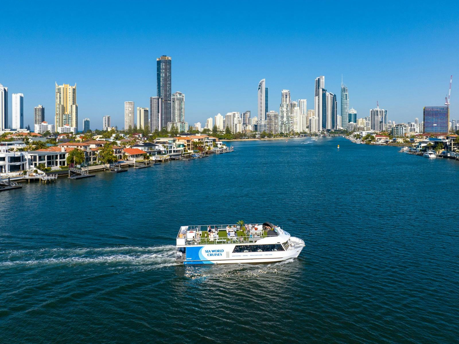 Spirit of Elston dining vessel on the Gold Coast Broadwater with city skyline.