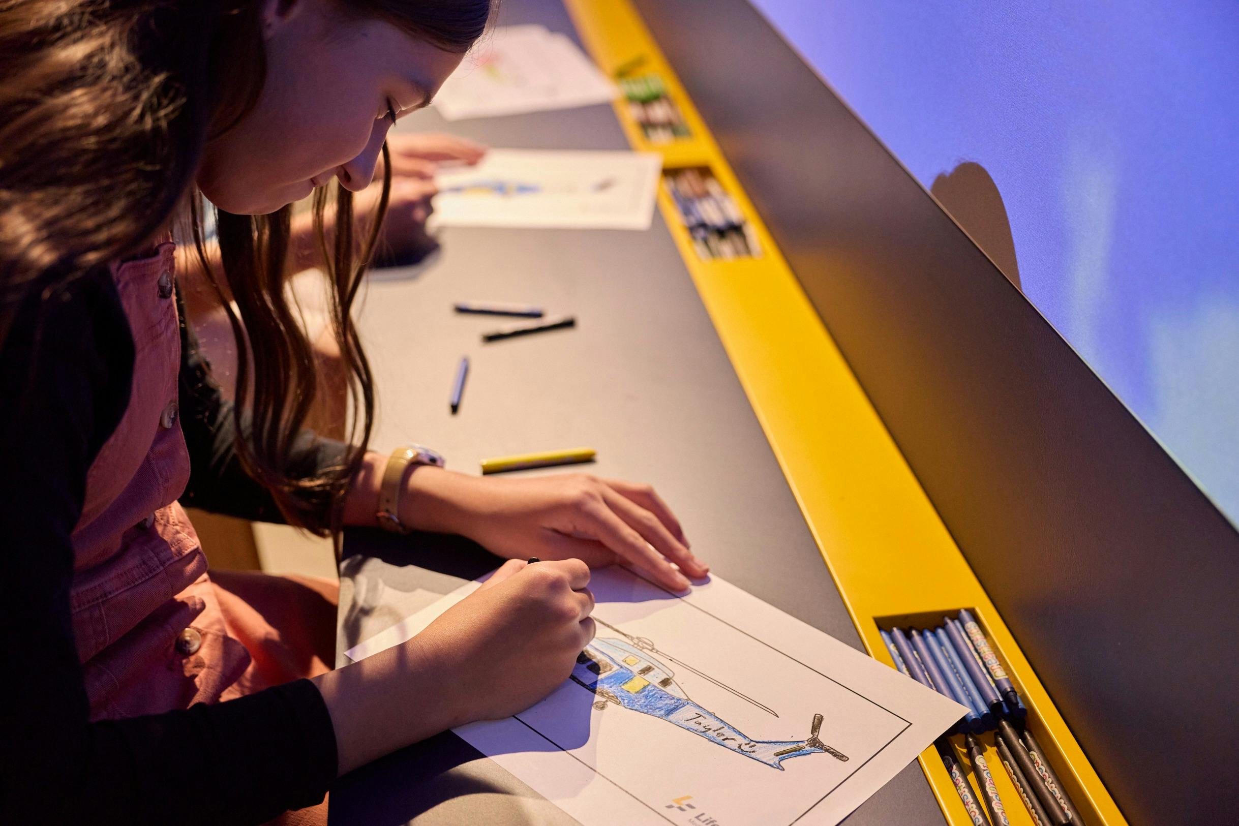 Colour in a helicopter and launch it through the projection wall