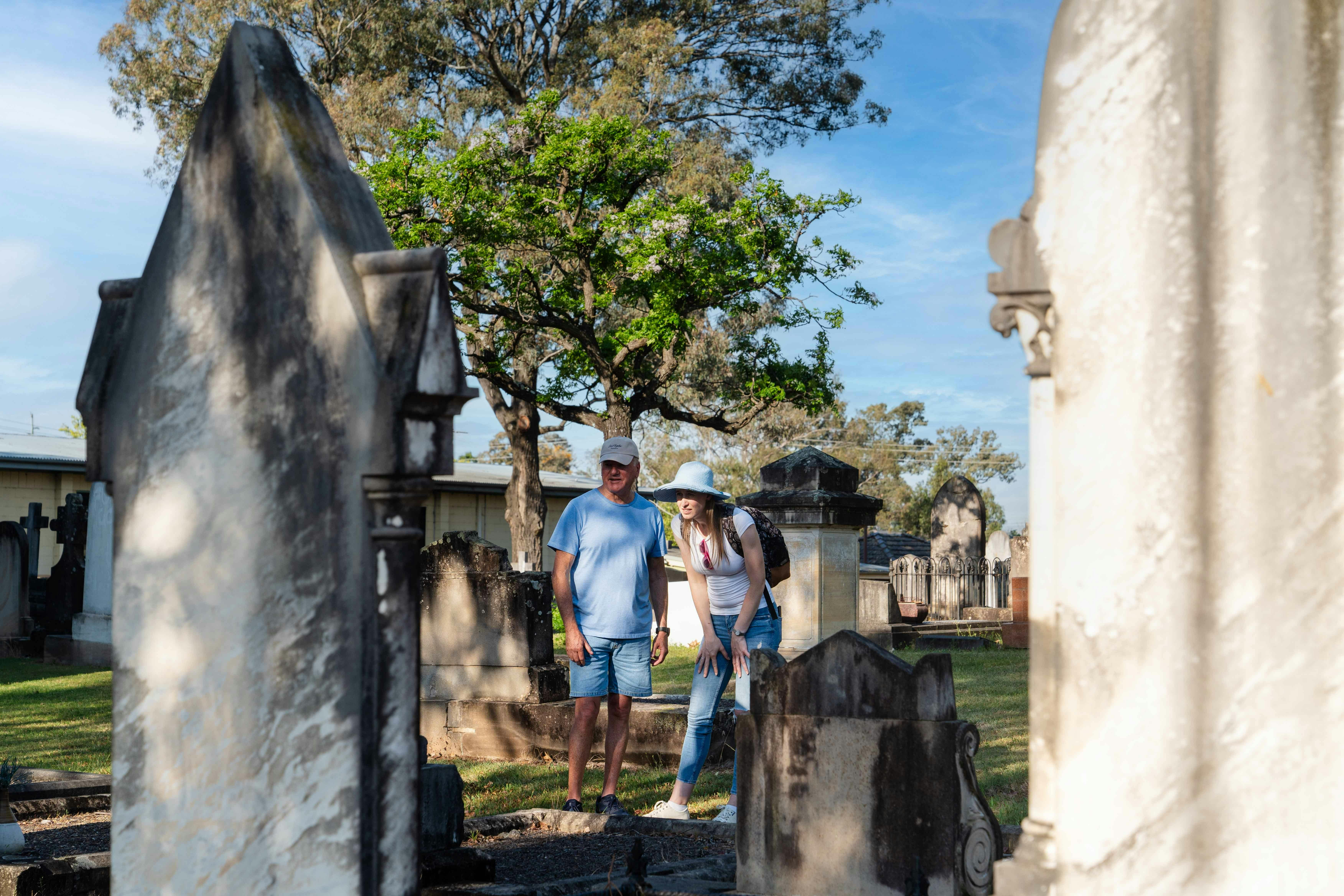 People in graveyard at St Mary Magdalene St Marys