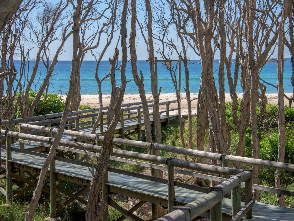 Our private boardwalk leads you onto Home Beach, Point Lookout.
