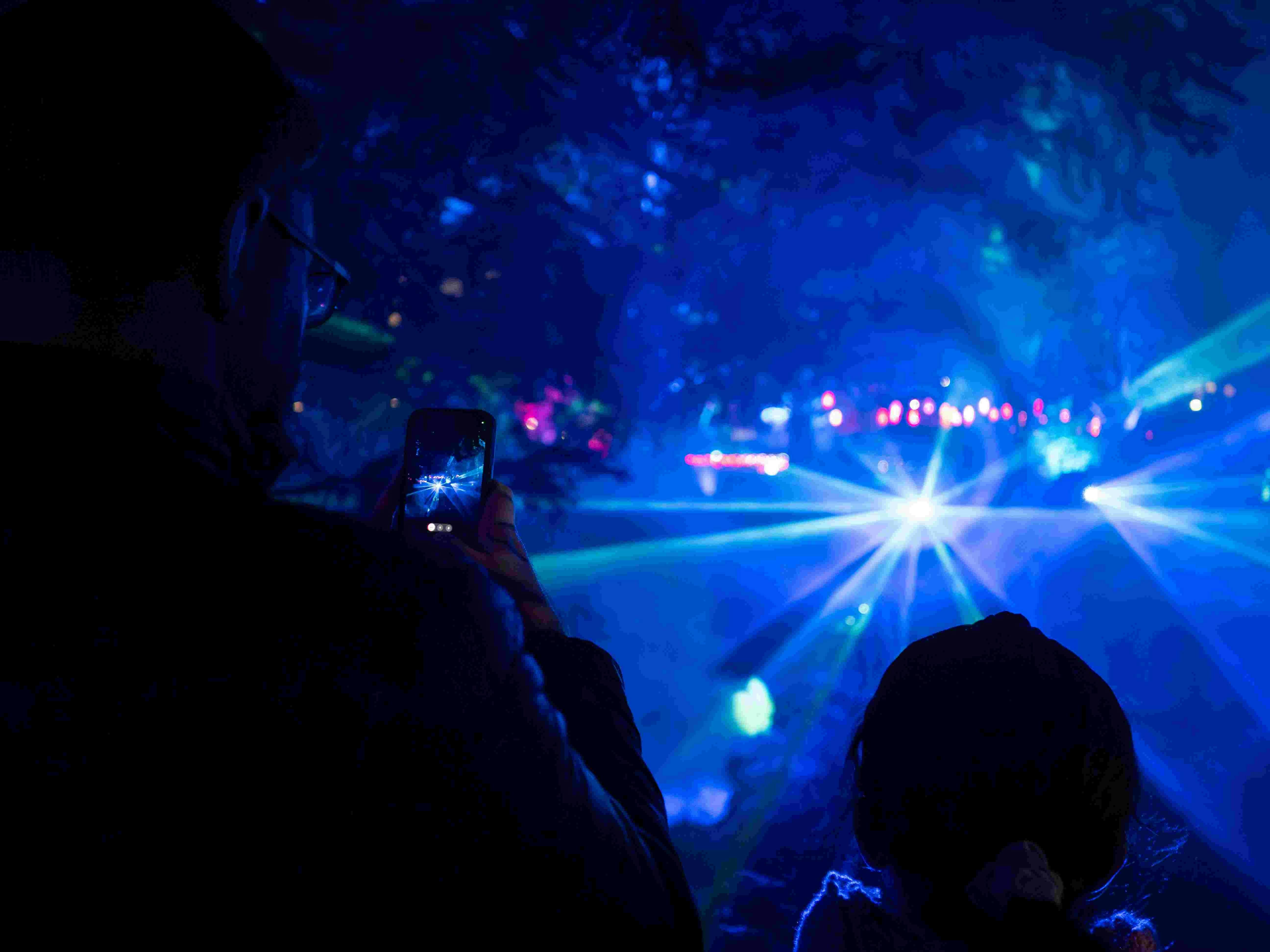 Family watching laser show