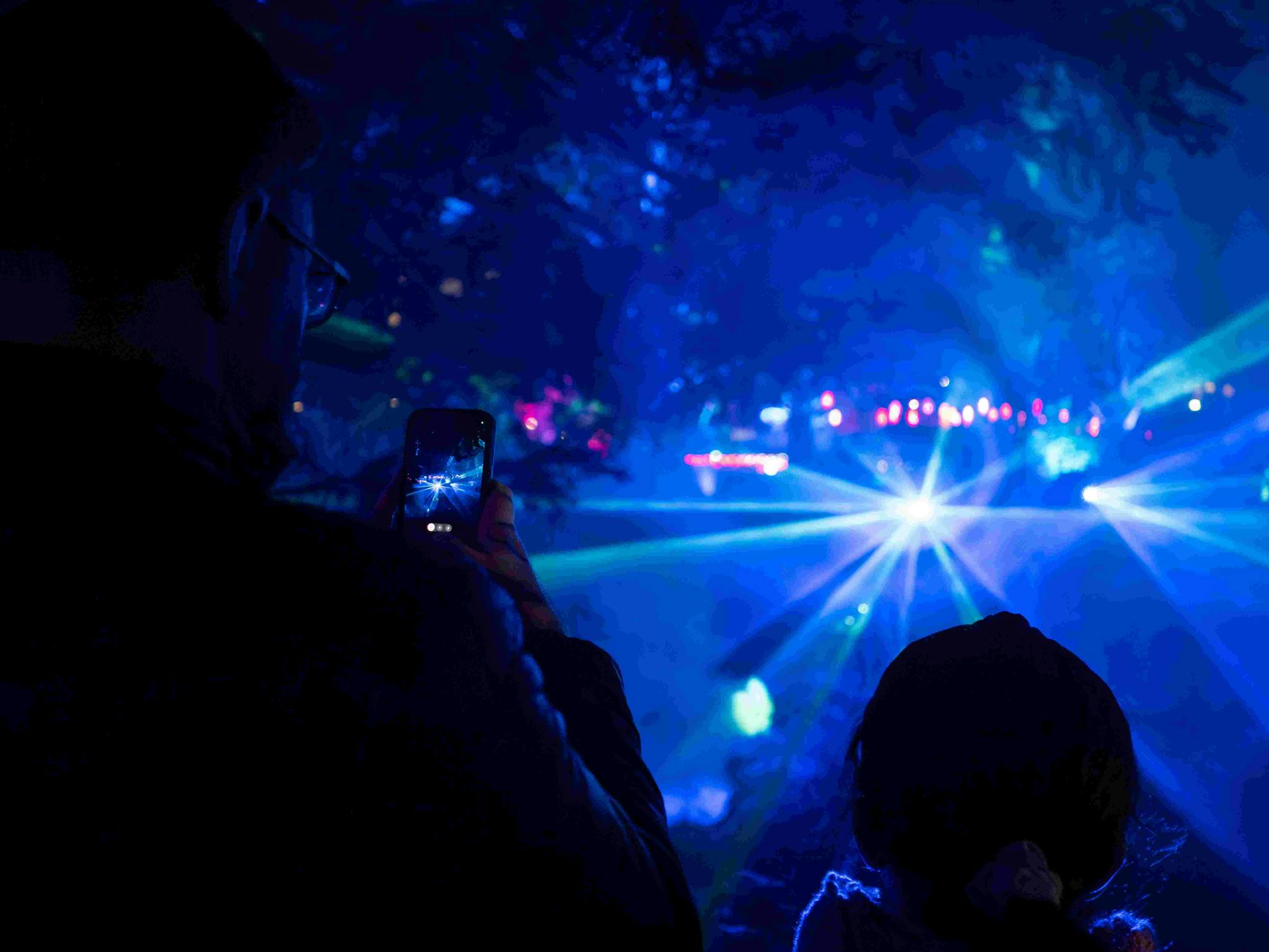 Family watching laser show