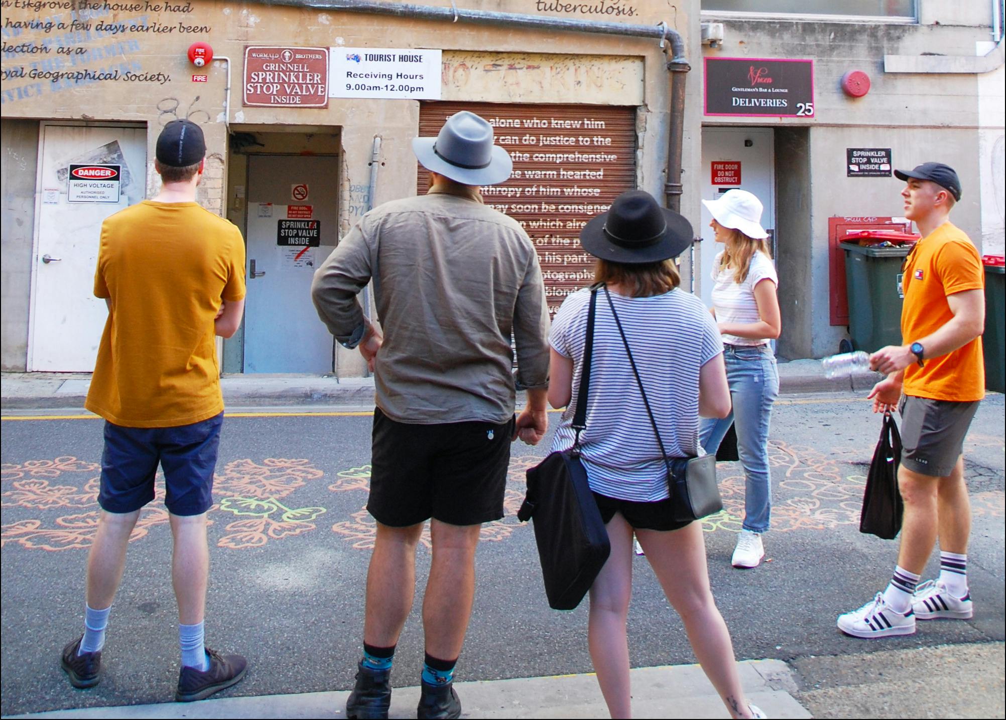 Group of five people in city laneway