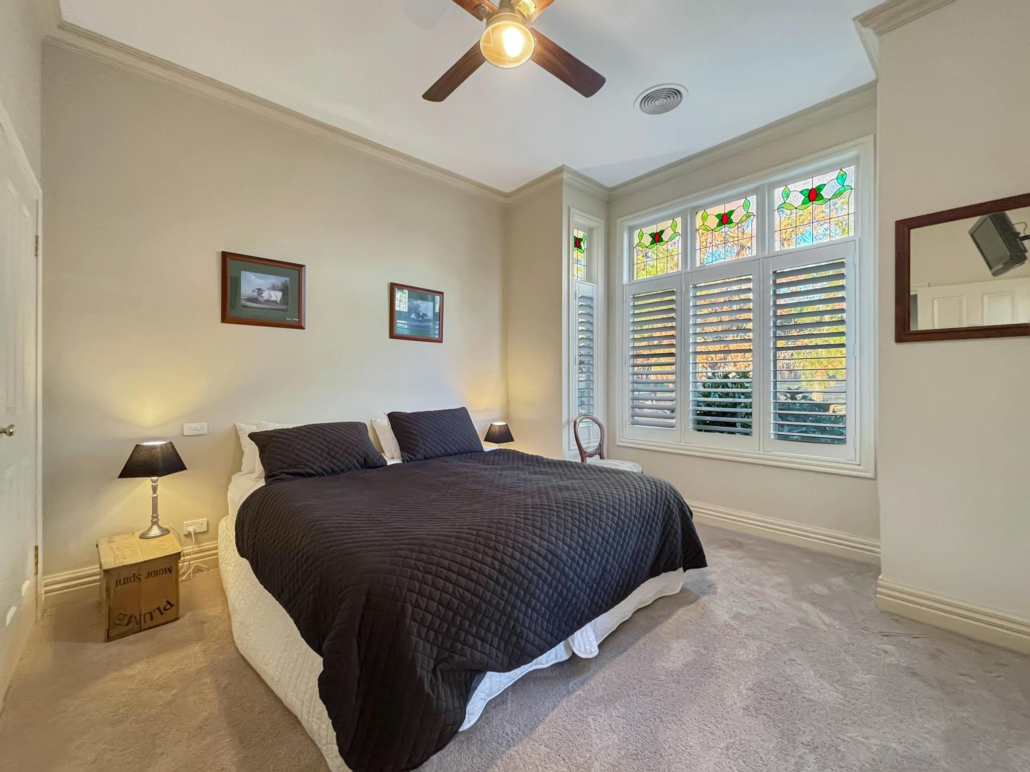Bedroom with bed and bed side tables and lamps at Rosedale House Mansfield