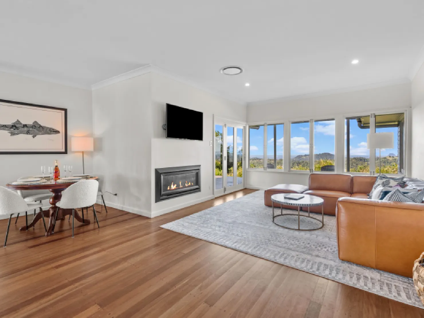 The living and dining areas are fully integrated with the kitchen and have sweeping views