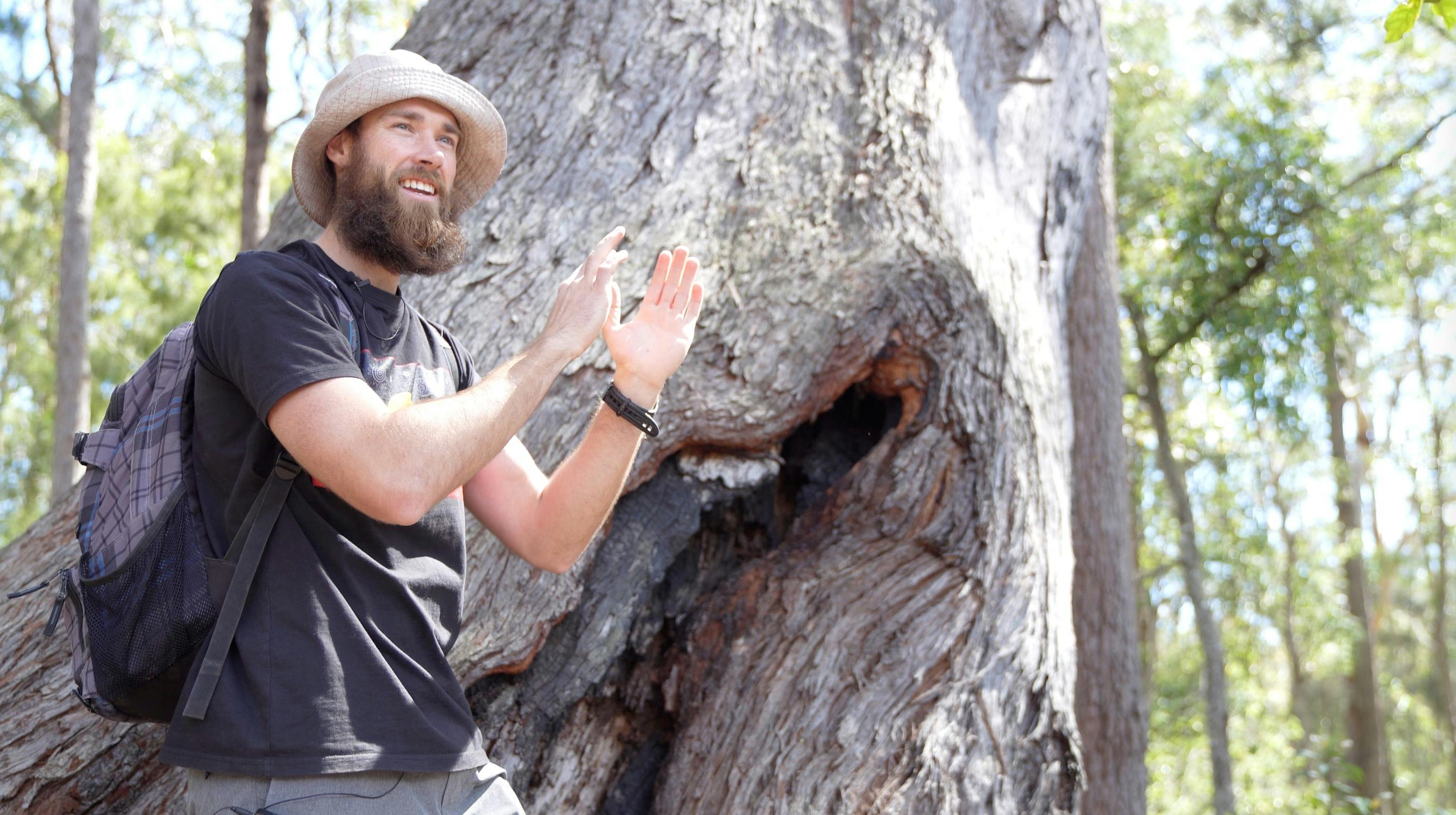 Felix in front of ancient grandmother tree