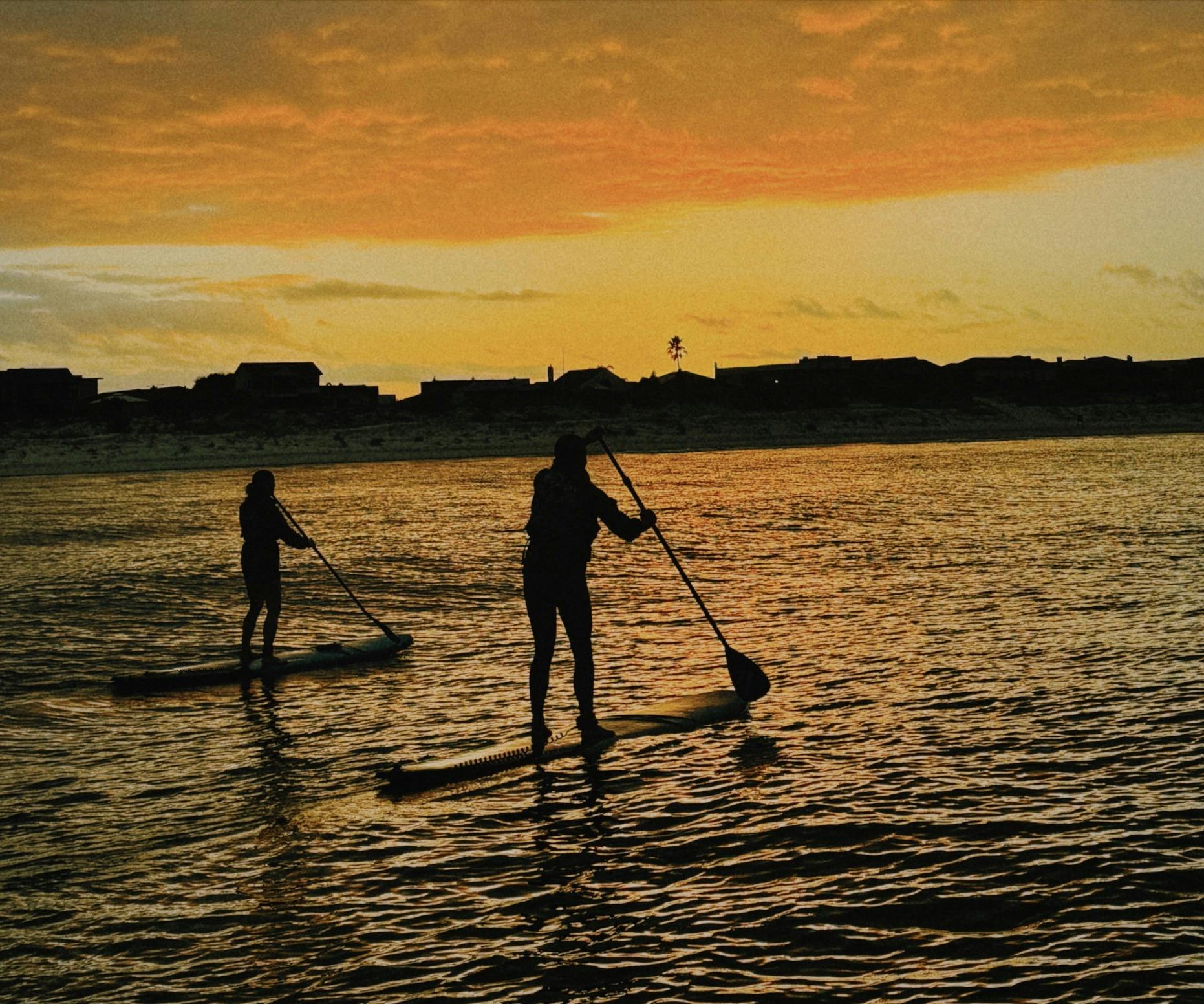 women's sunrise stand up paddle boarding