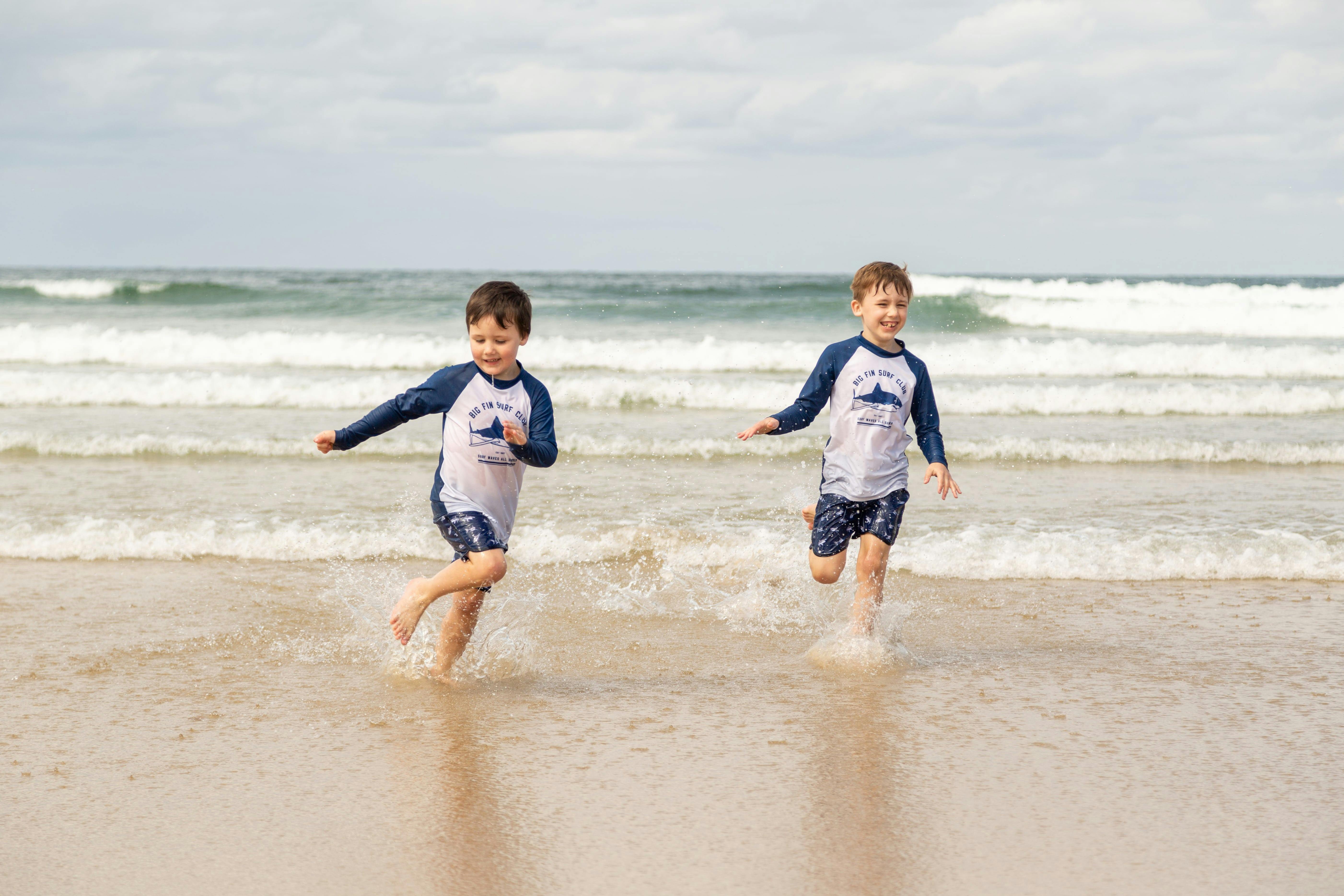 two kids playing in the water