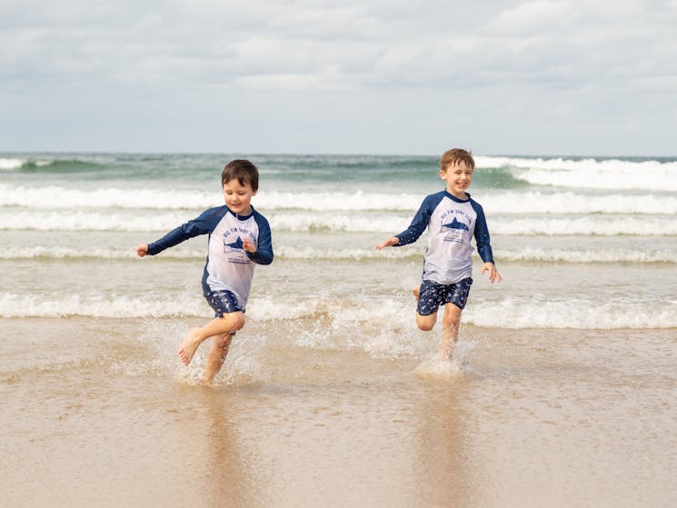 two kids playing in the water