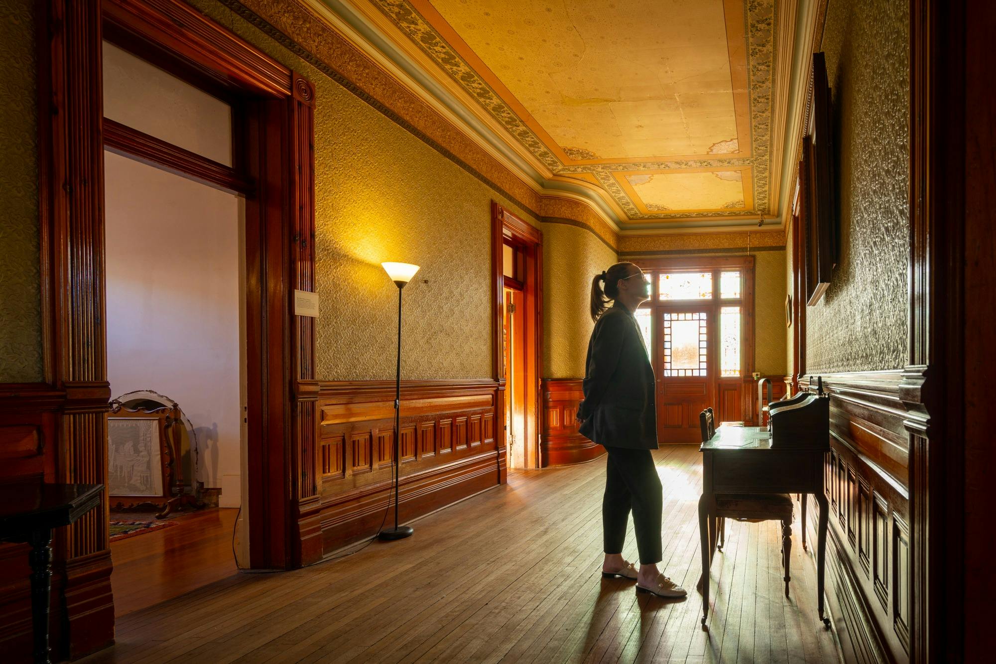 A female visitor exploring Rio Vista Historic House
