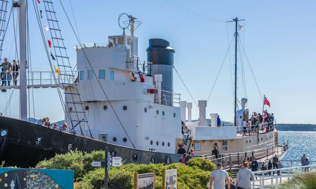 Side profile of Cheynes IV Whale Chaser Ship with guests walking over various deck levels.