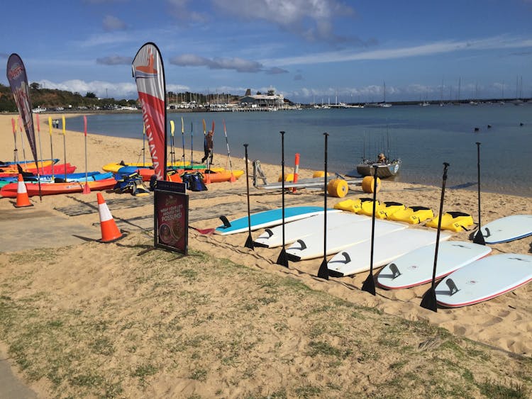 our Stand Up Paddle boards are on the beach ready for hire - Mornington Peninsula Melbourne